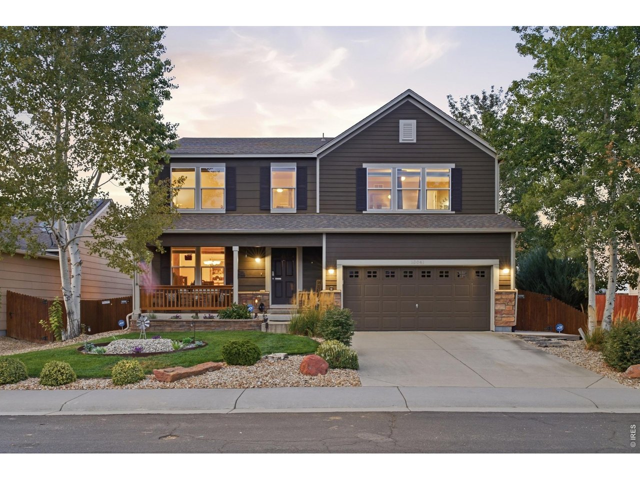 Welcome to 13841 Wrangler Way in Liberty Ranch that has been meticulously cared for and is ready for it's new owners! 3,754 finished square feet, four bedrooms plus a loft, and a basement that is actually used! The main floor is easy living. Living room and formal dining greet you first, then the kitchen with island and pantry opens to an eat-in space and a comfortable family room. Laundry and a powder bath sit complete the main floor. Wood floors in the kitchen wing; carpet in the living spaces. It feels like a house that has been cared for, because it has! Upstairs, the primary suite has a 3/4 bath with gorgeous walk-in shower and a large walk-in closet. Three more bedrooms, a loft that works as an office or hangout, and a full hall bath keep the rest of the floor simple and private. Downstairs is the fun. About 85% finished, with a fitness or flex room and a roughly 35-foot entertainment room with bar area. Unfinished storage, its own electrical panel, and three egresses. This space is ready for whatever entertaining or gathering you want to have! Then step outside. One direct neighbor. Private open space behind you. A greenbelt-style stretch to the side. Mountain views. A covered front porch, extra concrete patio, pergola, and a 13x24 covered rear deck with LED lighting, a ceiling fan, added privacy fencing, and 220 ready if you want a hot tub. This is the yard people stay home for. Sellers kept a dated list: radon mitigation 2019, sewer scoped 2020, toilets 2022, water heater 2022, furnace 2024, disposal and primary bath fixtures 2025, ducts cleaned 2026. Interior and exterior paint including deck and rails. LED lighting through most of the home, dimmers, updated window coverings, carpet on the basement stairs, and lifetime gutter protection on the house (transferable; rear deck excluded). A/C is 2017 and recently serviced. SVVSD schools. A short walk to the nearly complete new public library. This is a home you truly have to experience in person!