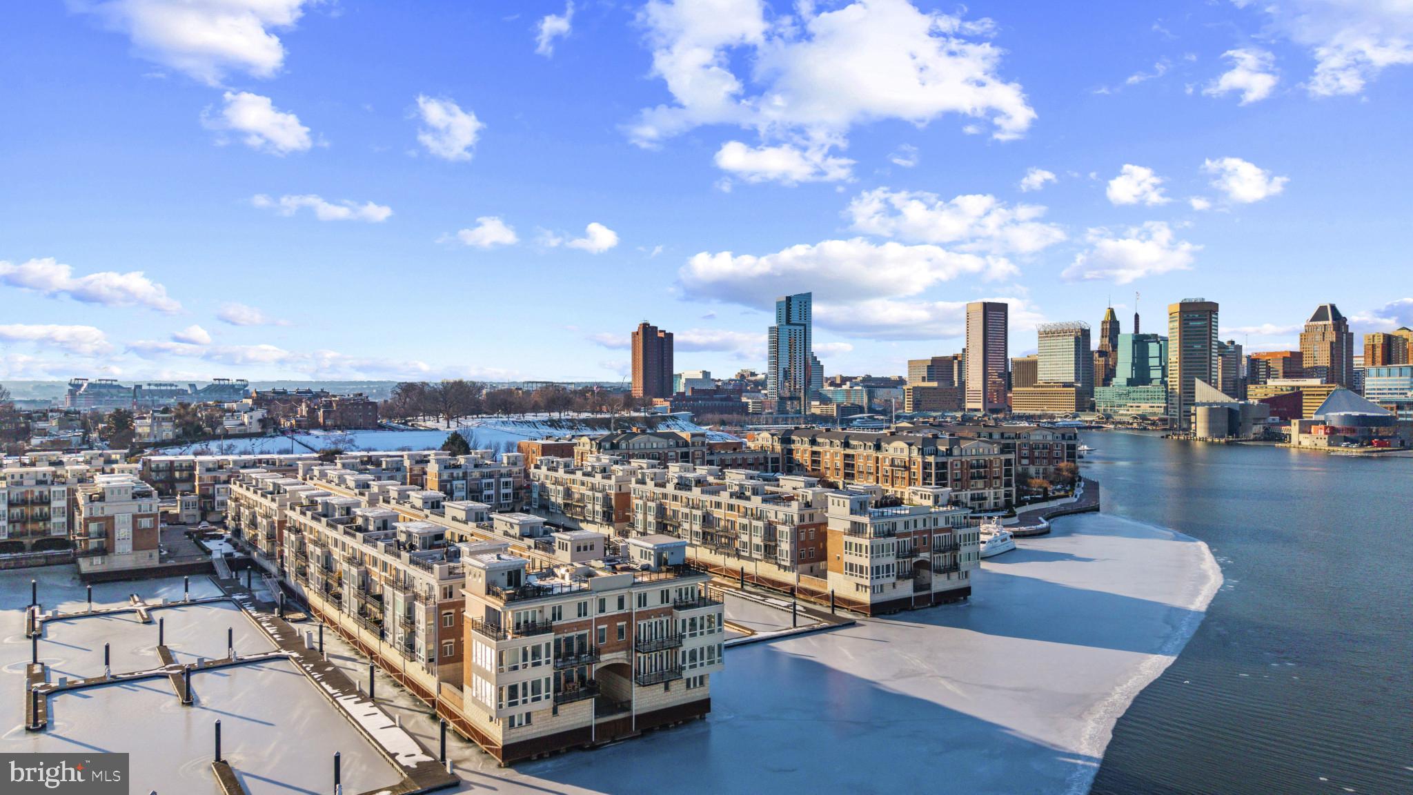 Experience elevated waterfront living at 628 Ponte Villas in the heart of Federal Hill—a rare opportunity to own a stunning 2-bedroom, 2.5-bath residence in one of Baltimore’s premier gated communities.Perfectly positioned along the water, this home offers breathtaking views, refined finishes and the privacy and security that discerning buyers seek. Inside, an open and light-filled layout seamlessly blends elegance and comfort, with expansive windows that bring the waterfront directly into your living space.The main level is designed for both everyday living and sophisticated entertaining, flowing effortlessly from the living and dining areas to a well-appointed kitchen. Upstairs you’ll find a spacious primary with a huge en-suite bathroom complete with standing shower and separate jetted tub with two walk-in closets. The top level offers another bedroom and full bathroom plus a striking open loft with custom built-in bookshelves that provides a versatile space—perfect for a home office, library, creative studio, or additional lounge area. This architectural feature adds character and distinction rarely found in comparable properties.You’ll love the huge roof deck with expansive harbor views and some stunning shots of Federal Hill.Additional highlights include a private 2-car garage, three verandas, ample storage, hardwood flooring, a cozy fireplace and the peace of mind that comes with gated community living.Enjoy the best of Federal Hill just outside your door—restaurants, shops, parks, and waterfront promenades—while coming home to a serene, private retreat.