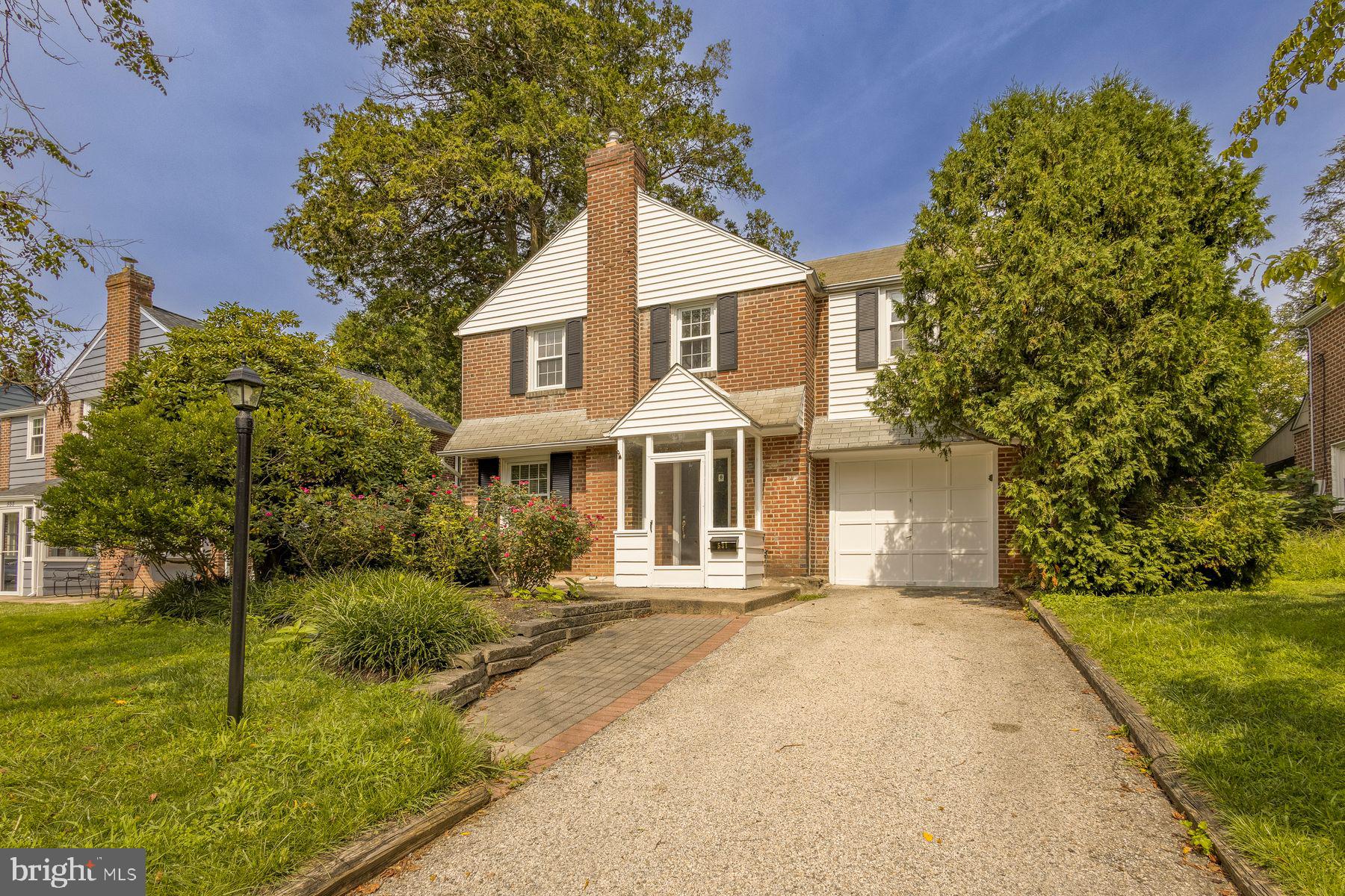 Set on a quiet, tree-lined street in Wynnewood’s Penn Wynne neighborhood, 531 Rock Glen Drive offers three bedrooms, two-and-a-half baths, a finished basement, and a flat, fenced backyard—all within the Lower Merion School District. Freshly painted throughout, the home combines classic character with comfortable, flexible living space.The living room features handsome built-in bookshelves and hardwood floors that continue into the dining room. The dining room opens directly to the kitchen with white cabinetry, granite countertops, and stainless-steel appliances. Just off the kitchen, a versatile TV/Media Room with its own half bath provides additional space for everyday living and entertaining.Upstairs are three bedrooms with hardwood floors and ample closet space, along with two full bathrooms. The finished basement adds flexible living space. Outside, the flat, fenced backyard offers a private setting for entertaining, gardening, or play, and a one-car garage provides additional storage. Wynnewood Valley Park, Penn Wynne Park, and the Penn Wynne Library are all nearby, along with neighborhood shops and everyday conveniences.