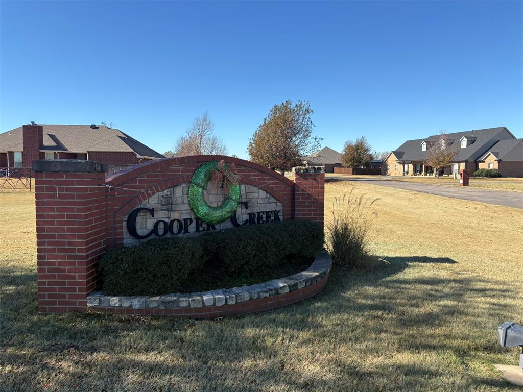 Nestled on a 1.5-acre lot in the desirable Cooper’s Creek Addition, this property offers an exceptional opportunity to build your dream home in a wooded and quiet neighborhood. The natural landscape and gentle slope make it perfect for a walk-out basement, providing both beauty and functionality.Conveniently located close to Riverwind Casino, restaurants, and just 15 minutes from the University campus and shopping district, you’ll enjoy the ideal balance of privacy and accessibility. With public utilities available, this prime location combines comfort, convenience, and the peaceful charm of wooded surroundings.