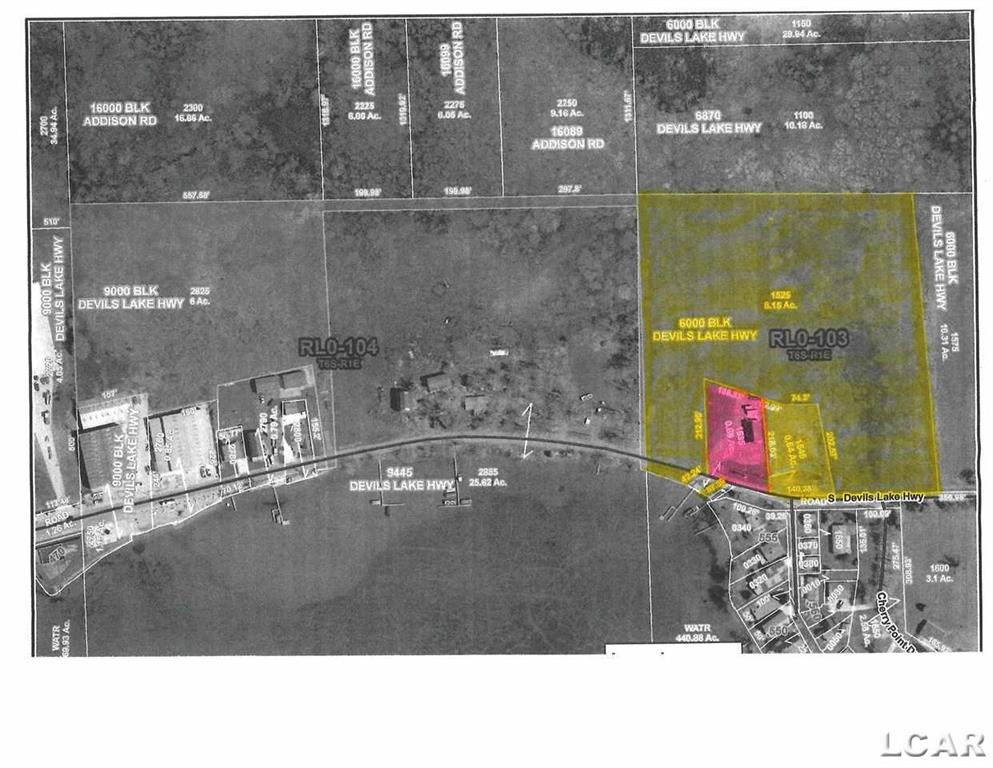 Approximately 9 acres with Devil's Lake frontage. Tons of potential development opportunities or perfect for a residential estate setting.