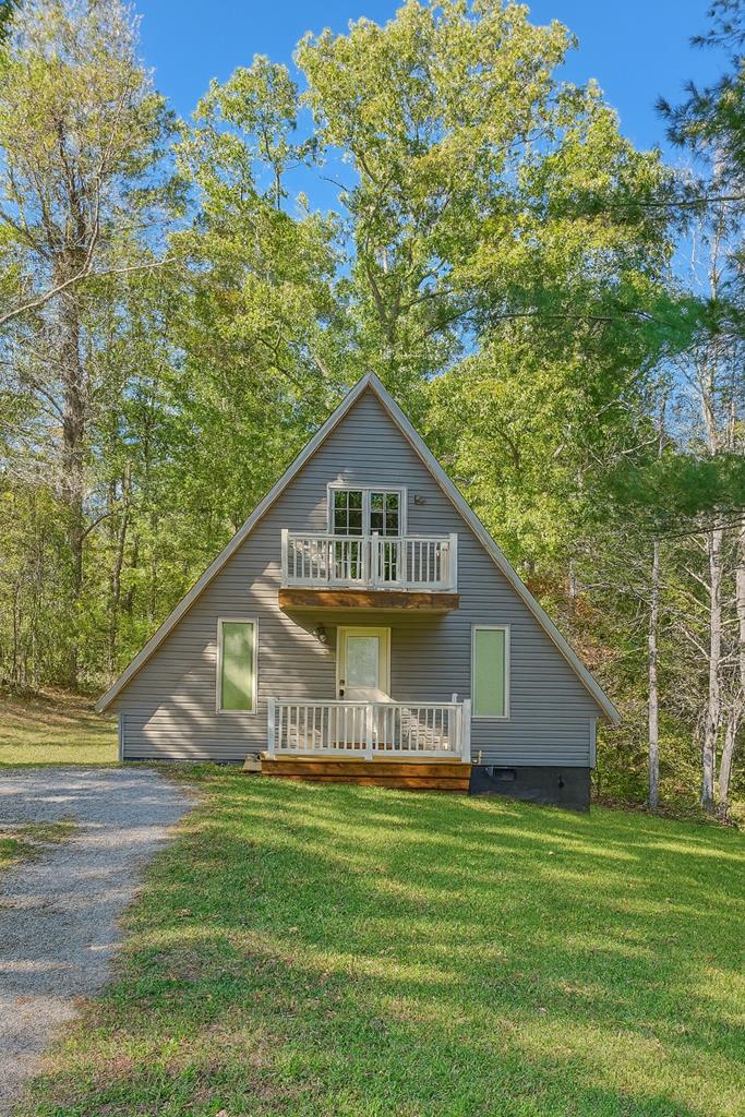 Gorgeous A Frame home located in Cana, close to I-77 and the Blue Ridge Parkway. Completely remodeled in 2023. New electric, plumbing, roof, dry wall, flooring, cabinets, countertops, windows, doors and bathrooms. 3 bedroom, 2 full bath. Main bedroom and bathroom on the first floor, 2nd and 3rd bedroom and 2nd bathroom on the second floor. All new decks on the front of the house and the back of the house. New appliances that include stack washer and dryer. Nice level front and back yard. There is a small portion of a stream that runs through the back corner of the property.
