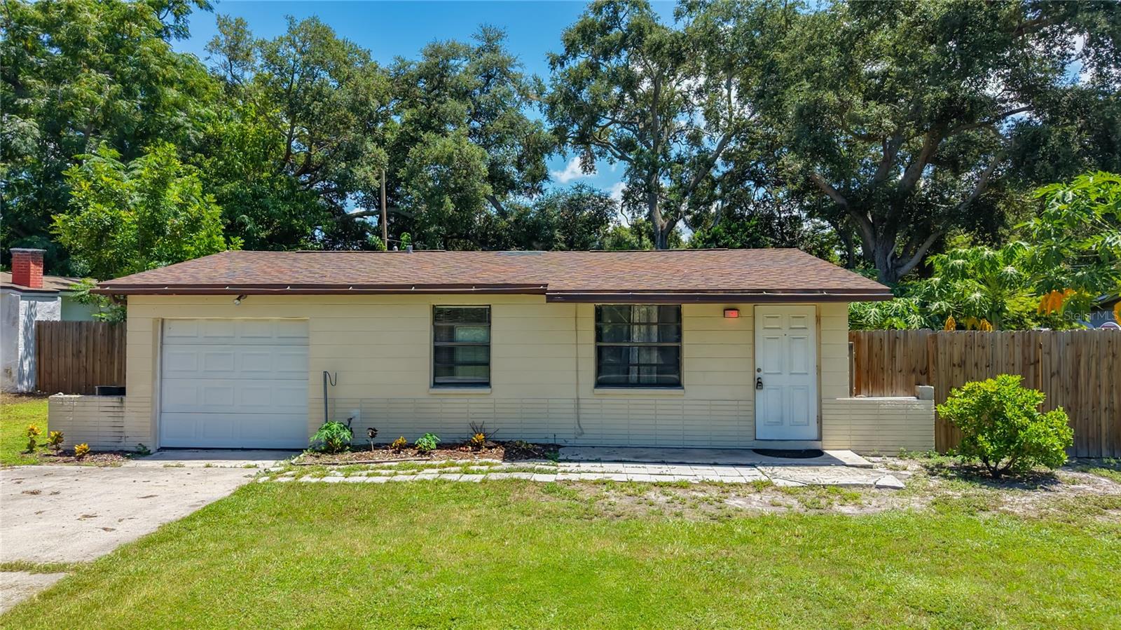 Welcome home.  This 2-bedroom, 1-bath home with a 1-car garage located in the heart of Pinellas Park. This charming property features easy-to-maintain ceramic tile flooring throughout and a bright kitchen with wood cabinets.  The bathroom has been completely updated with new tile in the shower and a wood vanity. Both the roof and A/C replaced 2028.   The garage offers flexibility and can remain as-is or be easily converted into a third bedroom. Step outside to a spacious backyard perfect for pets or children to play or for people who love to garden.   Centrally located in Pinellas County, you’re just a short drive from the Gulf beaches and minutes to Park Blvd, US-19, and I-275 for easy commuting. Best of all, there are no HOA or CDD fees.