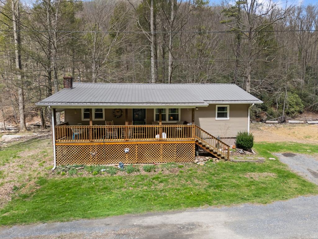 Looking for a place where you can slow down and actually breathe? This charming 3-bedroom, 1-bath home is tucked into one of Damascus's most scenic stretches. If you've been dreaming about creek views, mountain air, and easy access to outdoor adventure, this one's calling your name. Step outside and you're practically on the famous Virginia Creeper Trail, one of the most beloved rail-trails in the country. Whether you bike, hike, fish, or just love a good morning walk or afternoon swim, having Whitetop Laurel Creek in the back yard & trail steps from your front door is a game changer. Lace up your boots and explore The Appalachian Trail & Bear Tree Gap Trailhead for even more outdoor thrills, or wind down at The Creekside Cafe, a beloved local favorite less than a mile away. Inside you've got a solid layout with plenty of room to make it your own. The full basement is a huge bonus - think extra storage, a workshop, a hangout space, or even future living area if you want to expand down the road. This home has had many recent updates including vinyl siding & windows, hvac unit, water heater, back deck, and the roof is less than 5 years old. This property delivers the kind of peaceful living most people only dream about!