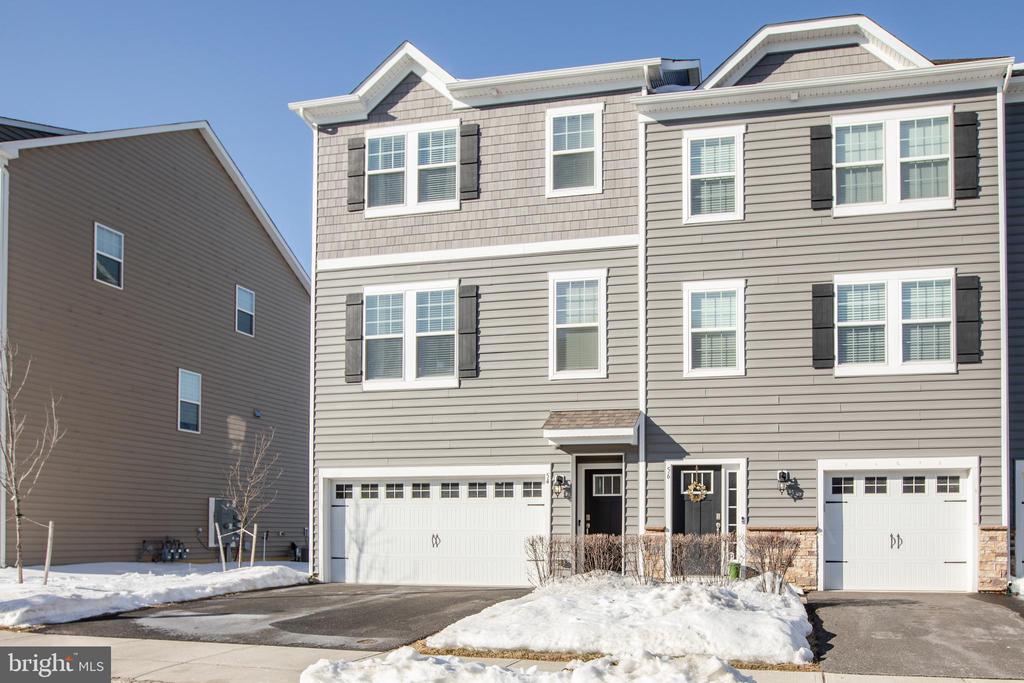 Welcome to this beautiful end of row Townhome in Signature Place  with 3 bedrooms two and half baths, and a two car garage with automatic garage lift, Entry level features a spacious family room with plenty of closet space, glass sliding door to your back yard,  this space would also be perfect for an  office,  guest room,  gym or a fourth bedroom, your choice.  Enter into Main level  which offers open concept, living room with plenty of windows for natural sunlight  and luxury vinyl plank flooring   that flows into the the well equipped kitchen with stainless steel appliances,  36 inch espresso cabinets, recessed lighting, quarts counter tops, breakfast island, dinning area, pantry and glass sliding doors to the deck.    Upstairs leads to the master suit with its own bath, large walk in closet along with two other spacious bedrooms, a full  bath with linen closet, and laundry room. Signature place is a commuters dream! This home is locate minutes from all major highways including  295, Route 38, Route 73, Route 70 and the New Jersey Turnpike plus  only minutes  to Moorestown and Cherry Hill. There are also many shopping and dining options just minutes from your home.