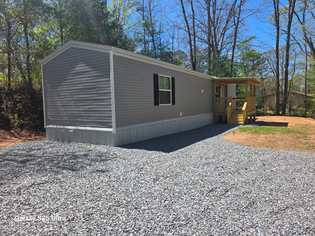 Brand new 2-bedroom, 2-bath manufactured ranch home situated on 0.75 acres in the desirable subdivision, The Haven. This thoughtfully designed home features a spacious open-concept layout with a large kitchen complete with granite countertops, ample cabinetry, and a full suite of appliances including dishwasher, microwave, range, and refrigerator. Beautiful laminate flooring flows throughout the main living areas, adding both style and durability. The home also offers a convenient laundry room and well-appointed bedrooms, including a comfortable primary suite with a private bath. Enjoy the peace and privacy of a generous lot while still being part of a welcoming community. A perfect blend of modern finishes and easy living—don't miss this opportunity!