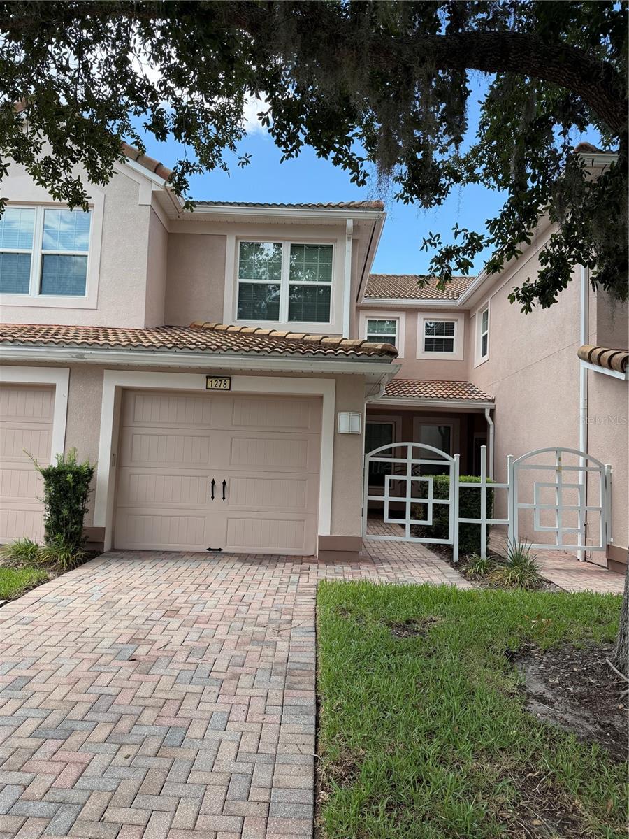 Luxury living at Promenades at Bella Trae Condominiums.  This full furnished 2bed/2bath with office is move in ready.  Also included is a one car garage and a screened patio looking over conservation.  Community facilities are many and include pool, fitness center, club house and putting green.  The community is fully gated for security.  Champions Gate location.
