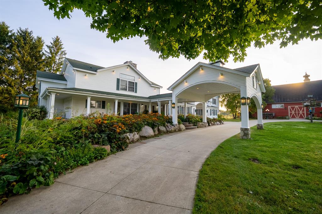 Stonegate Farm - A 40-Acre Legacy Estate Offering Luxury, Lifestyle, and OpportunityLocated in the rolling countryside of Lapeer County, Michigan, Stonegate Farm is more than just a property; it is a lifestyle, a business and a rare investment opportunity. Nestled just north of the charming village of Hadley and west of the historic equestrian community of Metamora. It is home to a luxurious residence, income-producing wedding and event venues and a diverse mix of productive agricultural ground. Few properties so seamlessly merge elegance with function, making Stonegate Farm one of the most compelling offerings in the region.From the gated entrance to the rolling fields and serene pond, every acre of Stonegate Farm reflects the balance of beauty and purpose. The setting places owners close enough to enjoy the conveniences of nearby towns while still offering complete privacy in the heart of Michigan's horse country and outdoor recreation corridor. For those seeking a place to call home, build a family legacy or expand a business rooted in hospitality and agriculture, this estate offers it all.The Residence - 6,000 Square Feet of Refined Country LuxuryThe centerpiece of Stonegate Farm is the 6,000-square-foot custom residence, carefully designed to combine comfort, elegance, and practicality. Featuring five spacious bedrooms and six bathrooms, the home balances private retreats with spaces made for entertaining.Upon entry, guests are welcomed into a grand foyer, currently styled as a bridal preparation suite - a space filled with natural light, perfect for pre-wedding moments. This unique adaptation highlights how the residence is not only a family home but also an integral part of the estate's role as a premier wedding venue.The kitchen serves as the home's hub, featuring premium appliances, expansive counter space and a design that flows naturally into the dining and living areas. Whether preparing a quiet family meal or working alongside professional caterers during an event, the space is both funct