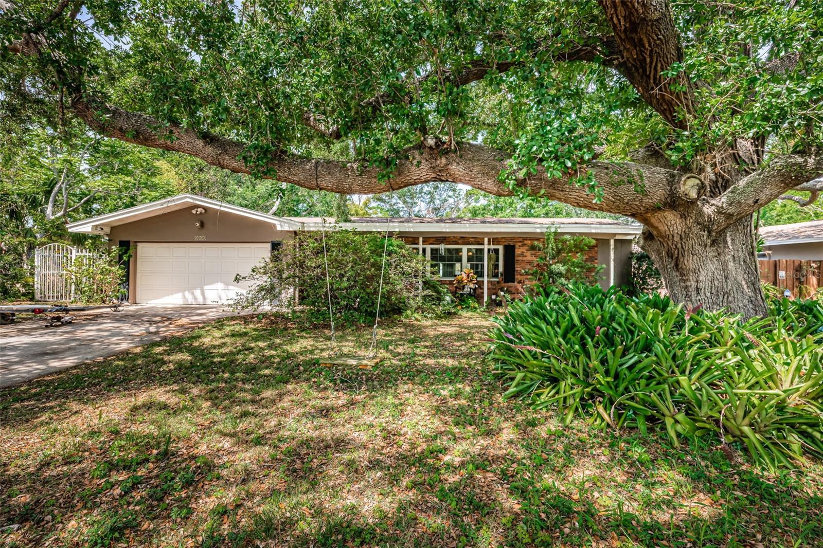 Great 4 bedroom/4 bath Ranch style home located in the desired Lakewood Estates Community. This house has 2 primary bedrooms. The main bedroom boasts an en-suite, his and hers walk-in closets, private patio and access to the pool. The other primary is separate from the rest and has its own full bath. Walking into the house, either through the living room or kitchen area you come to 3 French Doors overlooking the outdoor space with a huge in-ground, caged pool. Covered area is a great spot for relaxing, even better for entertaining.  The house is situated across the street from St. Petersburg Country Club golf course.  Minutes away from downtown St. Petersburg and all it has to enjoy, some of the best beaches and Boyd Hill Nature Preserve.  Must come and see!