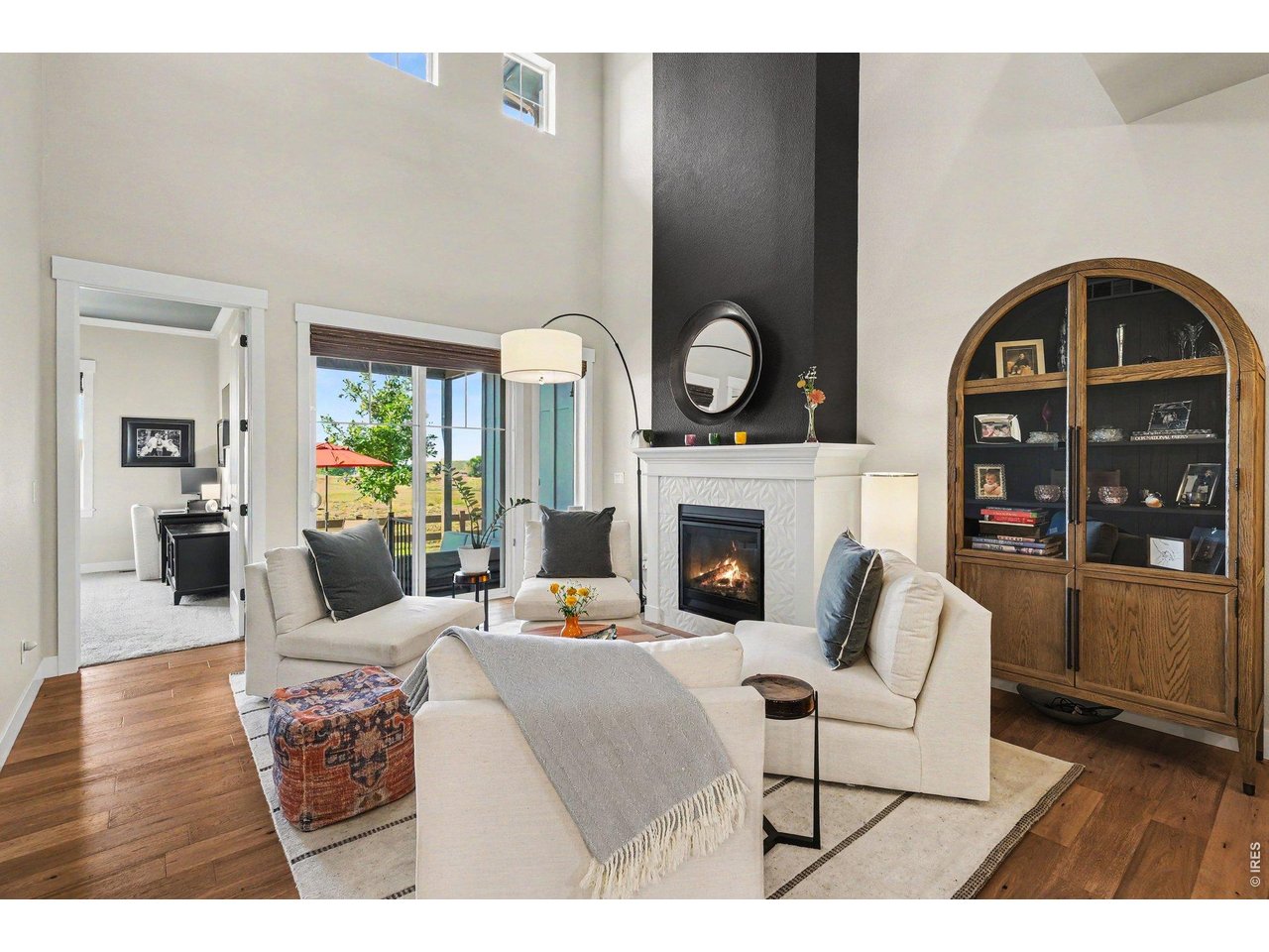 Welcome to effortless luxury living in Harmony Club. Tucked away on a quiet crescent street, this beautifully appointed 3,521-square-foot townhome offers 4 bedrooms, 3.5 baths, stunning Front Range and golf course views, and the perfect blend of elegance and low-maintenance living. A redesigned courtyard garden filled with colorful blooms welcomes you home, creating a peaceful retreat. Inside, soaring two-story ceilings, expansive windows, and rich hardwood floors fill the home with natural light. The main floor features a spacious living and dining area, well-appointed kitchen, butler's pantry/bar, laundry room, powder bath, and a private primary suite with golf course views and a generous walk-in closet. Upstairs, a versatile loft is ideal for a library or home office, accompanied by two additional bedrooms with mountain and golf course views. The finished lower level serves as an ideal guest retreat with a bedroom, full bath, walk-in closet, spacious family room, and abundant storage. Relax on the extended patio while watching golfers pass by or enjoying Colorado's star-filled skies. Whether you're seeking a lock-and-leave golf retreat, room for visiting family, or carefree everyday living, this home offers exceptional flexibility. Transferred ownership includes access to Harmony Club's outstanding amenities, including dining, fitness, tennis, pickleball, walking trails, and a vibrant social calendar. Nearby Timnath Reservoir offers boating, fishing, paddleboarding, biking, and seasonal community events. During the holidays, Harmony Club transforms into a magical winter wonderland with spectacular seasonal lighting that makes every drive home feel special. Harmony Club Sports Membership Initiation Fee: $11,000 to be paid by Buyers at closing. Sports Membership is $303.50 monthly, which includes golf 5x a year. Cart is $80. Golf Membership: $36,000 paid by Buyer at closing (instead of $11,000) and $823.50 per month. Seller is a licensed real estate agent in CO