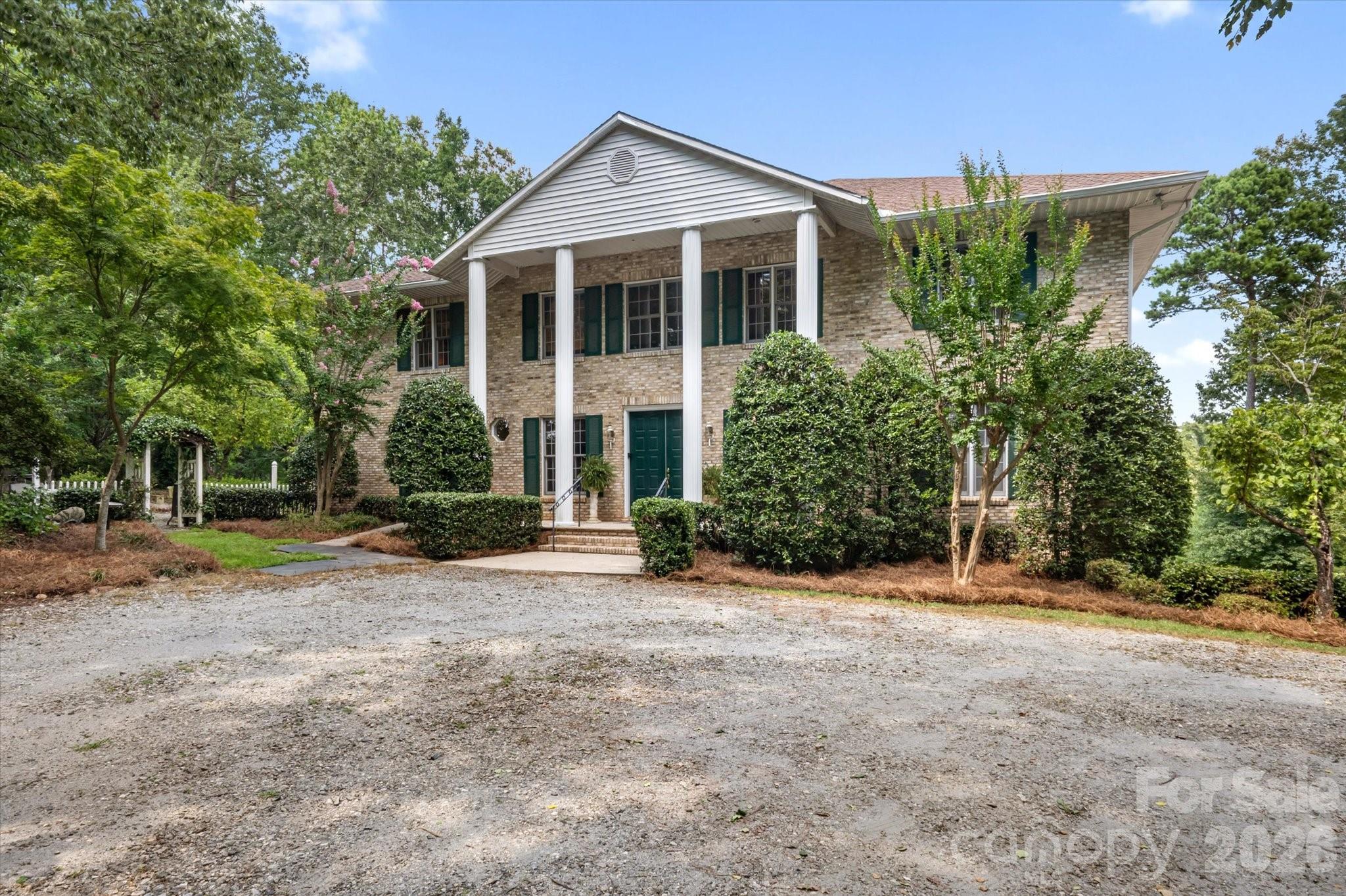 Spread out in style in this 4,560 SQ FT luxury home on a 2+ acre DOUBLE-LOT.  Located in Red Fox neighborhood of Tryon, this stunning home offers a spacious open floor plan, comfortable sun room, and an office fit for the CEO!  If you like walk in closets, ten foot ceilings, and balconies, then THIS IS THE PRIMARY SUITE FOR YOU.  The Grand Salon is exactly that---GRAND.  At over 800 square feet with twenty foot ceilings, it takes your breath away as soon as you pass through the giant, double door entrance and see this magnificent space.  The basement is partially finished with a full bath, and is perfect for a workshop or storage. WHOLE-HOUSE GENERATOR RECENTLY INSTALLED SO YOU NEVER LOSE POWER WHEN YOU NEED IT MOST!!   Come see this remarkable property in person to fully appreciate the value and beauty.  Red Fox is one of the most popular neighborhoods in Polk County, located 10 minutes from Landrum, Tryon, Columbus, and Tryon International Equestrian Center.  25 minutes to DOWNTOWN HENDERSONVILLE.