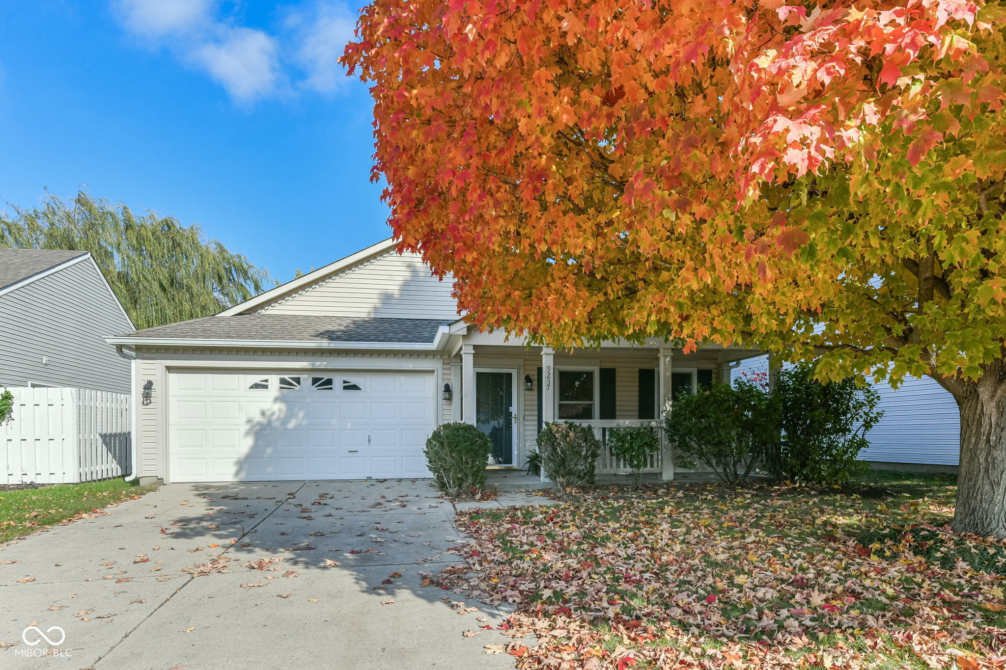 This CONVENIENTLY located well loved 1620 sq ft RANCH with cozy front porch has an open concept great room that flows to kitchen.  The great room has a gas fireplace.  The EAT IN kitchen has a pantry and all kitchen appliances are included. Washer, Dryer and Water Softener stay too!  Each bedroom has a "walk-in"  closet.  The primary bathroom has a double bowl vanity and linen closet. Back yard is fairly "private",  partially fenced and has room to run and play.  Nickel Plate Trail, Fishers District, Fishers Event Center, schools and shopping are all very close!  Don't miss this gem! Easy to show!