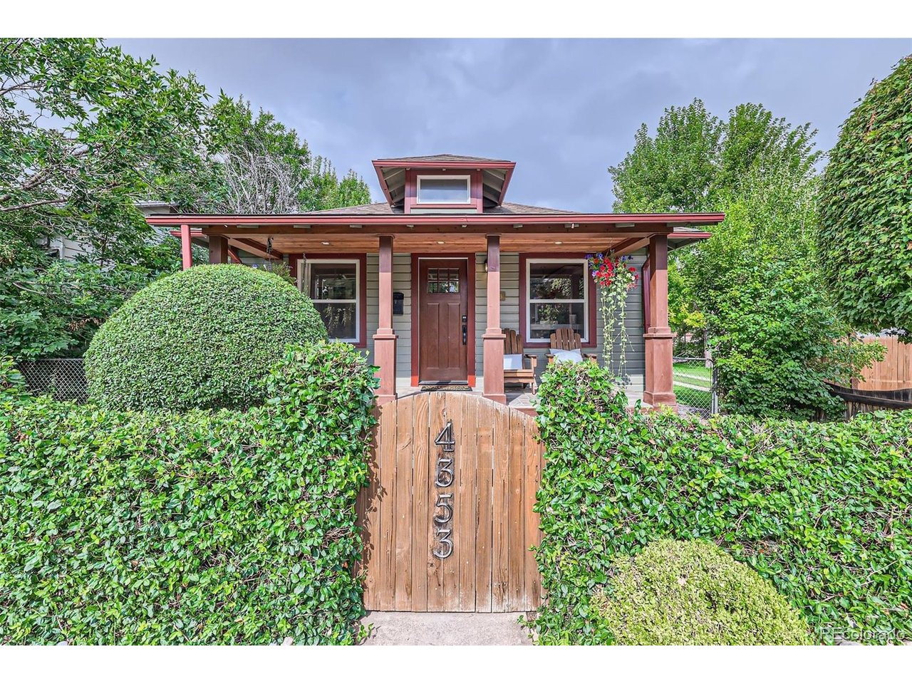Timeless 1920s Craftsman charm meets modern updates on an extraordinary triple lot! Bursting with character and thoughtfully updated, this four-bedroom bungalow offers a rare combination of historic charm, incredible outdoor living, and an exceptional oversized three-car garage, all in a fantastic central location.The inviting front porch, towering mature trees, and professionally landscaped grounds create an undeniable sense of charm. Inside, original character blends beautifully with modern finishes, including newly refinished wood floors, fresh interior paint, brand new carpeting, and double-pane windows. The beautifully updated kitchen features striking quartz waterfall countertops, a large farmhouse sink, stainless steel appliances, and a gas range. The outdoor spaces are equally impressive! Situated on an expansive triple lot, the property offers an incredible amount of room to entertain and relax. A large, freshly stained deck overlooks the fantastic backyard with an inground gas firepit-- an easy and lovely upgrade! Mature trees, beautiful landscaping, and a storage shed complete this exceptional outdoor retreat. And then there's the garage! A truly rare find, the massive oversized three-car garage features impressive 10-foot ceilings, electrical service, and abundant space for vehicles, storage, hobbies, or a workshop. Major improvements, including a new HVAC system (2025) and water heater (2026) provide added peace of mind. With its expansive triple lot, exceptional garage, thoughtful updates, and unmistakable Craftsman character, this is a truly special property offering a combination of features rarely found in such a central location. A one-of-a-kind opportunity to enjoy the charm of yesterday with the comforts of today!