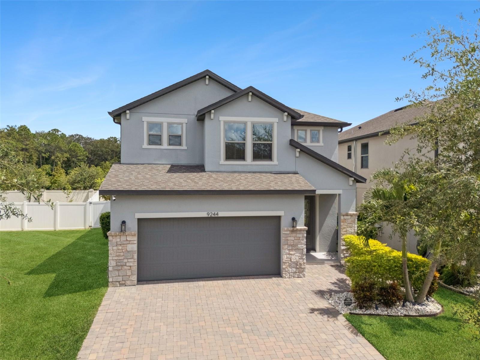 Welcome to 9244 Juniper Moss Circle, an energy-efficient certified home by Beazer Homes located in Moss Park Reserve near Lake Nona's premier dining, shopping, and entertainment. This spacious two-story home offers 2,494 square feet of living space with 4 bedrooms and 3 full bathrooms, including a convenient first-floor bedroom and full bath. Step inside to discover a bright and open layout with laminate flooring throughout, creating a seamless and stylish flow. The kitchen features quartz countertops, a natural gas stove and connects effortlessly to the dining area and living room. Sliding glass doors off the living room open to an expansive covered patio and a large, fenced backyard with plenty of space to entertain or unwind—plus a pre-installed pipeline for an outdoor kitchen hookup, making it easy to create your dream backyard oasis. The stairs to the second level lead to a generously sized loft, offering a flexible space for a home office, play area, or media room as well as the additional bedrooms and bathrooms. Home has a water softner and reverse osmosis system that conveys with the home.  Moss Park Reserve offers a community pool and playground for your enjoyment. Just minutes to Orlando International Airport, Medical City, Lake Town Center and easy access to highways.