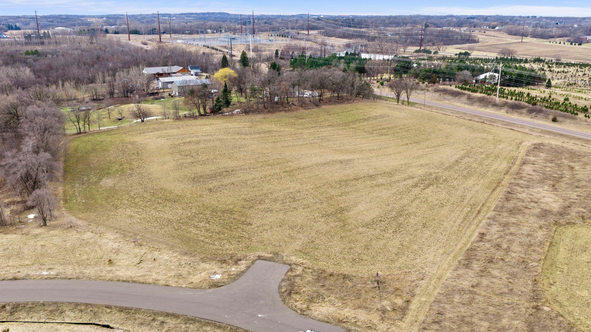 Discover stunning acreage lots in Rice Lake Estates, featuring gently rolling terrain and serene countryside views—all tucked away on a quiet, secluded street. Enjoy the perfect balance of privacy and community, with expansive open land surrounding the neighborhood. Two walkout lots are available, each offering over 2.5 acres—perfect for building your dream home. Conveniently located just minutes from I-35W, with easy access to multiple lakes, parks, golf courses and downtown Lakeville’s dining and shopping. Commuting is a breeze with a short drive to Minneapolis–St. Paul, the Mall of America, and MSP Airport. Located within the highly regarded Lakeville School District 194. Bring your own builder or partner with ours - Stone Cottage Construction.