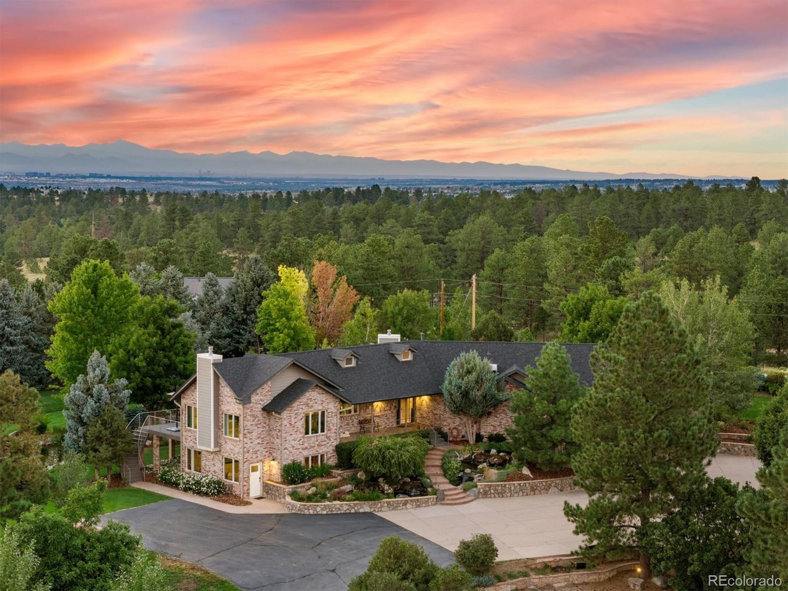 WOW! Spectacular residence! This home is totally amazing!! There is simply nothing like this at this price point! This exclusive residence has it’s own spectacular custom single hole par 3 golf course. Complete w/ sand traps & a relaxing pond & boat dock. Property is manicured and breath taking. Spectacular views of the front range. Over $1M in landscaping, ponds, and golf course finishes! The massive water features are unlikeany you have ever witnessed in a private home! The multiple water features & landscaping are truly impressive! The landscape lighting at night is a wow! Horse property with maintained riding trails throughout the neighborhood. Enjoy a one of a kind home & property that is straight out of a magazine! This walk-out ranch radiates with custom finishes - Spacious kitchen & breakfast room - New bathrooms, radiant floor in master bathroom & more. The vaulted main level pours with passive sunlight & offers a true Zen like experience. The master suite has its own intimate deck for total privacy. Melt away your stresses of life as you overlook paradise! Front & back walk-out doors. Nearly 3 acre site is fenced w/ security entry. Well with deep well water rights and also a water softener, tankless water heater and steam humidifier. The 3 car garage + park you RV, there's a 24' x 40' RV garage/shop with 2nd level mezzanine storage. Chicken coops are included, a cool hobby. Security cameras for peace of mind. Perfect for more equipment, vehicles, gym, workshop, studio and more! Living in this calm, peaceful environment is soothing to the soul. Brand new windows, gutters and exterior paint. The roof is also only a few years old. FAST fiber optic is available for those who work from home. A simple MUST SEE residence.