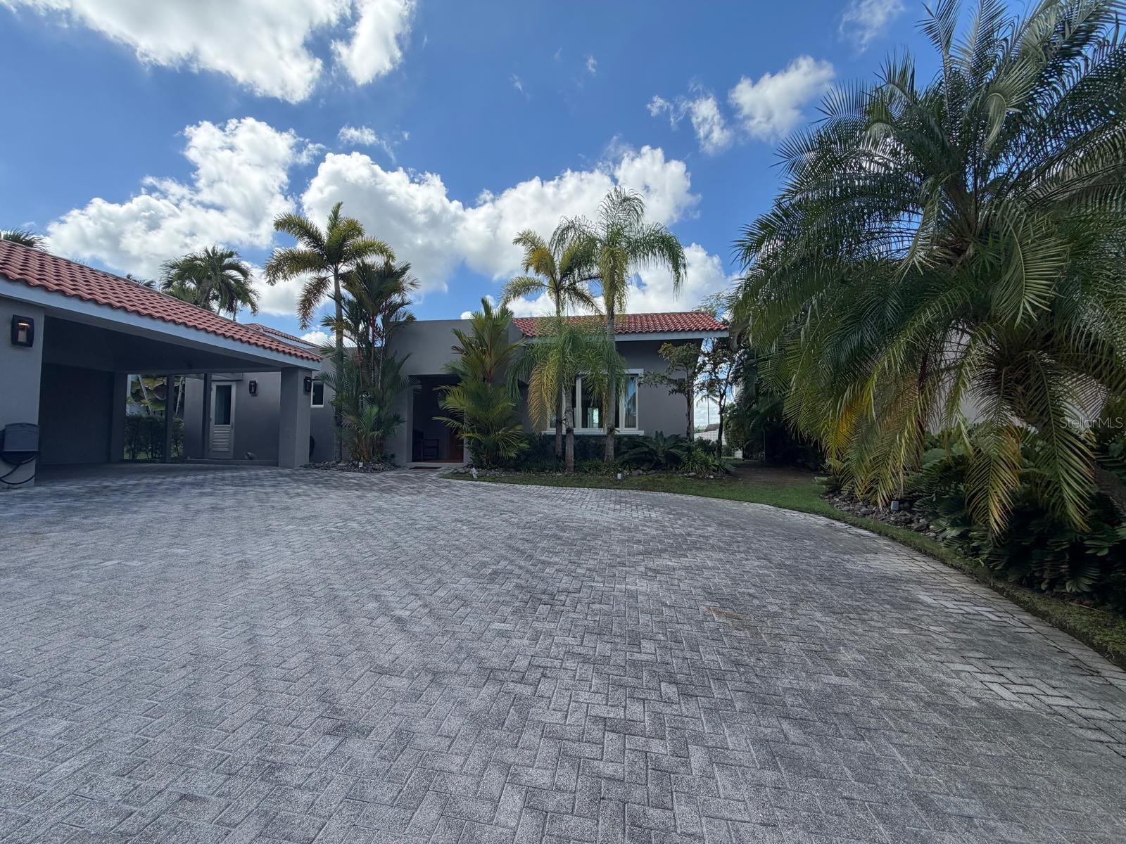 An Exceptional Residence in Dorado Beach EastSet within the distinguished enclave of Dorado Beach East at Dorado Beach Resort, this elegant residence offers a refined retreat where contemporary design meets the relaxed beauty of Caribbean living. Encompassing approximately 3,000 square feet of interior space on an expansive 1,293 square meter lot, the property offers a rare sense of privacy, generous proportions, and a natural connection to its lush surroundings.The home features three spacious en-suite bedrooms and three and a half bathrooms, with inviting living and dining areas designed for both intimate moments and effortless entertaining. Soaring ceilings and abundant natural light enhance the home’s open, airy feel, while a covered terrace creates a seamless setting for enjoying the outdoors throughout the day.Offered furnished, the residence is ready to enjoy, with stainless steel appliances, air conditioning throughout, a diesel generator, and a cistern. A two-car garage adds convenience and functionality, while the property’s well-kept green surroundings complement its peaceful setting.Beyond the residence, Dorado Beach Resort offers a celebrated resort lifestyle, with pristine beaches, championship golf, fine dining, tennis, water sports, wellness and fitness experiences, and curated resort services. Access to certain facilities and amenities may be subject to membership and applicable requirements.Private, gracious, and beautifully situated, DBE #268 presents an exceptional opportunity to own a turnkey home in one of Puerto Rico’s most sought after resort communities a place to gather, unwind, and experience the distinctive pleasures of Dorado Beach.