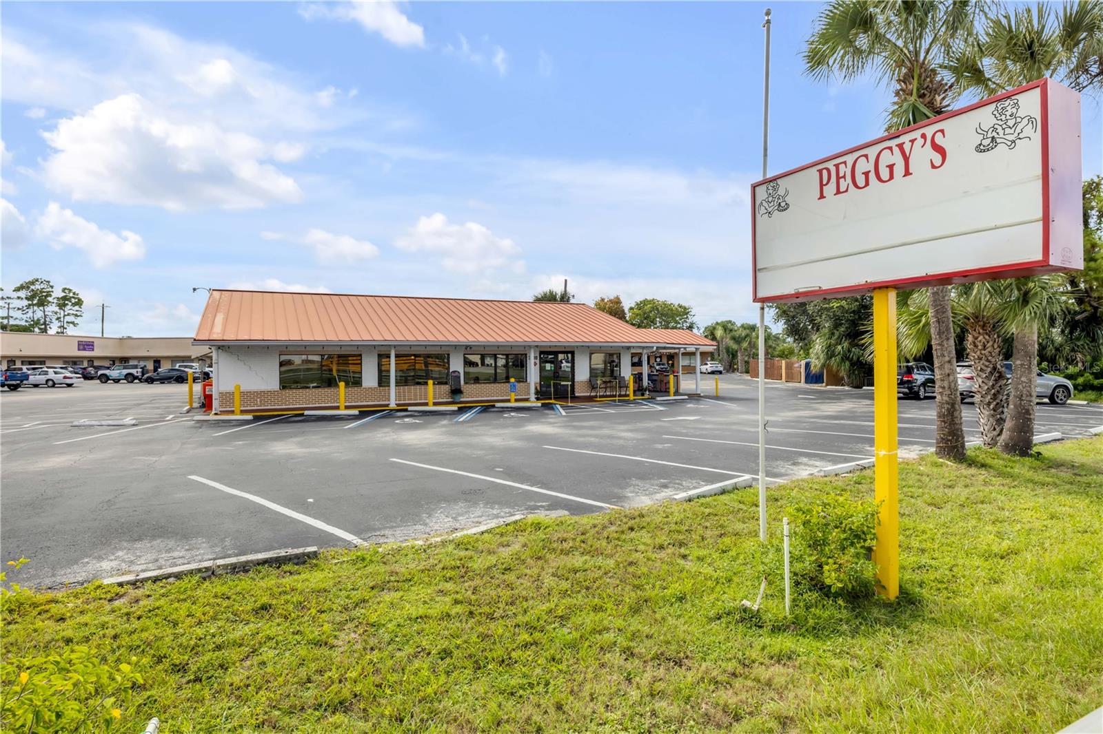 Versatile Commercial Space – Iconic Edgewater Landmark

This 2,400 SF block building with a durable metal roof is a well-established Edgewater landmark with over 35 years of history. Zoned for restaurant use and ideally located, the property offers excellent visibility and accessibility, making it a prime spot for your next business venture.

Currently set up as a turnkey restaurant, the building comes fully equipped with commercial kitchen appliances, tables, chairs, lighting, and 30 dedicated parking spaces—everything you need to open your doors on day one. It’s a fantastic opportunity for a new or experienced operator to take over a fully functional space in a high-traffic area.

The property includes extensive storage and a wide range of equipment: drink machines, freezers, coolers, a Pepsi fountain, dessert cooler, grill, deep fryers, commercial dishwasher, and a full set of plates, silverware, and more. It’s stocked with everything a restaurant owner could need to hit the ground running, saving time and significant startup costs.

While tailored for restaurant use, the flexible layout and strong location also make it suitable for a variety of other business types, including retail, office, or specialty services. Whether you're launching a new concept or expanding an existing brand, this iconic building offers the space, tools, and reputation to support your success. All information is deemed to be accurate but is not guaranteed.