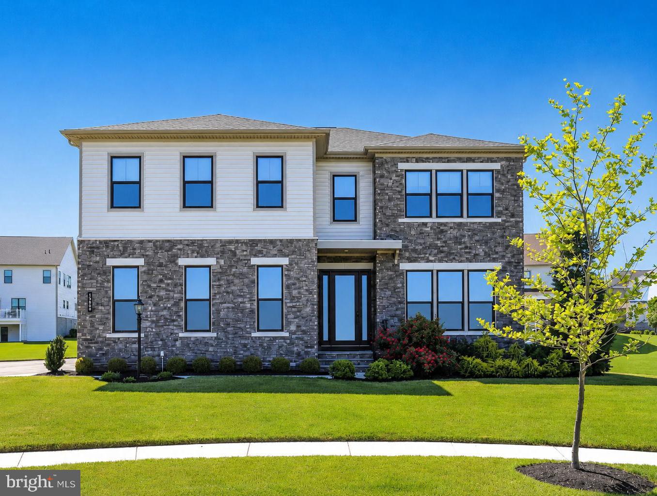 Like new Toll Brothers perfection!Welcome to this beautifully designed East facing six bedroom, five and a half bath residence offering over 5,700 finished square feet of thoughtfully planned living space in the heart of Lenah Mill. From the moment you step through the front door, you'll appreciate the home's spacious layout, elegant finishes, and seamless flow designed for both everyday living and effortless entertaining.The main level begins with a gracious foyer flanked by a private office, creating the perfect work from home retreat. Continue into the heart of the home where an expansive living and family room opens to the gourmet kitchen, complete with a large center island, abundant cabinetry, and a convenient walk in pantry. The adjoining dining area provides ample space for gatherings, while the mudroom offers practical everyday functionality with ample storage and direct access to the garage. Just beyond the family room, the screened-in porch extends your living space outdoors, creating the ideal setting for morning coffee, al fresco dining, or relaxing evenings overlooking the backyard.Upstairs, a spacious central lounge provides a versatile secondary living area perfect for movie nights, homework stations, or a quiet retreat. The luxurious primary suite serves as a private sanctuary, featuring a tray ceiling, dual walk-in closets, and a spa-inspired bath with separate vanities, tub, and oversized shower. Three additional bedrooms each enjoy access to their own bathrooms and walk-in closets, while the conveniently located upper level laundry room enhances everyday convenience.The finished lower level offers exceptional flexibility with a large recreation room, wet bar, game room, and two additional bedrooms, making it ideal for guests, multigenerational living, fitness space, or a home theater. A full bath serves the lower level, while an expansive unfinished storage and utility area provides abundant room for seasonal items, hobbies, and future customization.Completing the home is an attached two car garage with interior access, complemented by a spacious driveway for additional parking. Combining generous living spaces, functional design, and sought-after Lenah Mill amenities, 24935 Flaming Tree Court presents an outstanding opportunity to enjoy comfort, flexibility, and modern living in one of Loudoun County's most desirable communities.