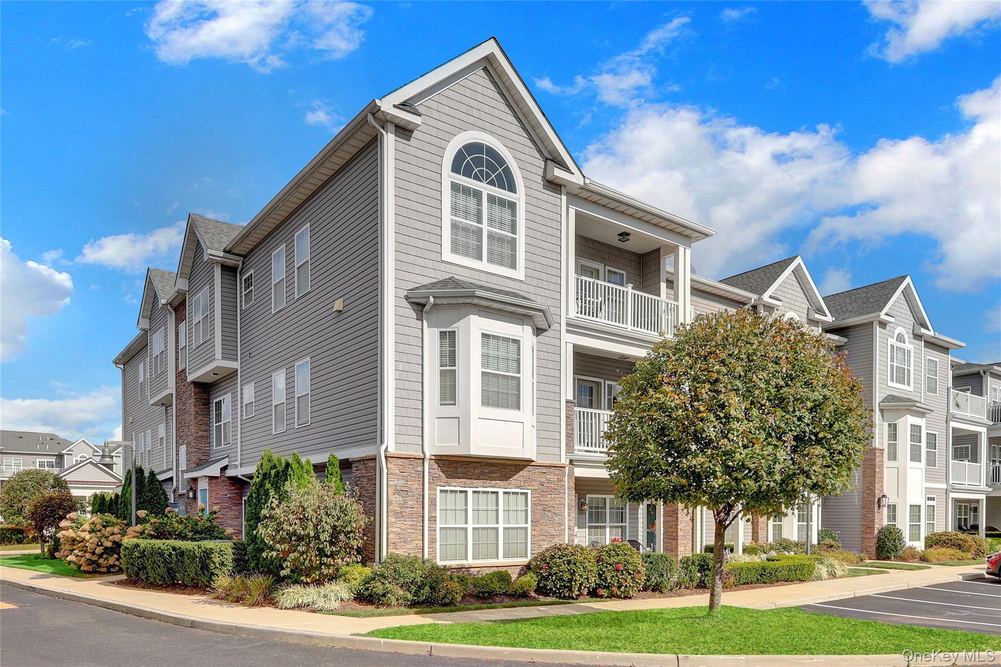 Welcome to The Club at Melville – An Exclusive 55+ Lifestyle Community

Discover comfort, convenience, and community living at its best in this beautifully maintained first-floor residence located in the sought-after Club at Melville. Built in 2017, this spacious two-bedroom, two-bath home offers an abundance of natural light and modern amenities throughout.

Step inside to an inviting open floor plan featuring sun-filled windows, generous living and dining spaces, and oversized bedrooms, each with its own full bath for maximum privacy and comfort. The primary suite includes a double-sink vanity and walk-in shower, while the second bedroom is ideal for guests or a home office. You’ll also love the large laundry room with ample storage — a rare and valuable feature

The Club at Melville is a vibrant, active 55+ community offering a wealth of amenities, including a beautiful clubhouse, fitness center, game room, and outdoor swimming pool. Enjoy a variety of activities such as cards, Mahjong, and social gatherings with friendly neighbors. The community also provides an elegant space for entertaining large parties and events.
This home combines low-maintenance living with an upscale lifestyle and is conveniently located close to shopping, dining, and transportation.

171 Clubhouse Circle — where every day feels like a retreat.