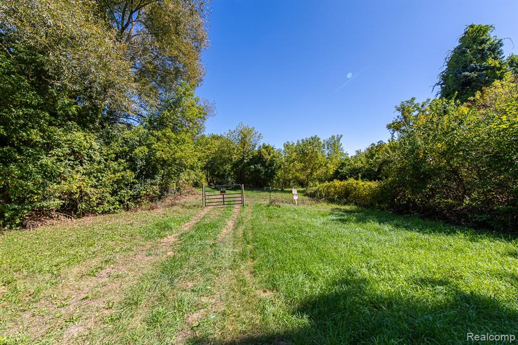 Incredible opportunity to own 14.59 acres of prime vacant land in Clarkston, bordering the sought-after Avington Park subdivision. This parcel offers space, privacy, and endless potential for development, recreation, or building your private estate.  Mostly open, level terrain that borders prestigious Avington Park, one of Clarkston's premier developments.  Excellent location near I-75, Pine Knob, shopping, dining, health care, and the ever popular Village of Clarkston.  Surround yourself with abundant wildlife and natural beauty, or bring your developer creativity to this rare acreage so close to Clarkston Road.  Whether you’re a builder, investor, or discerning homeowner, this is a rare chance to secure one of the most desirable parcels in Clarkston.