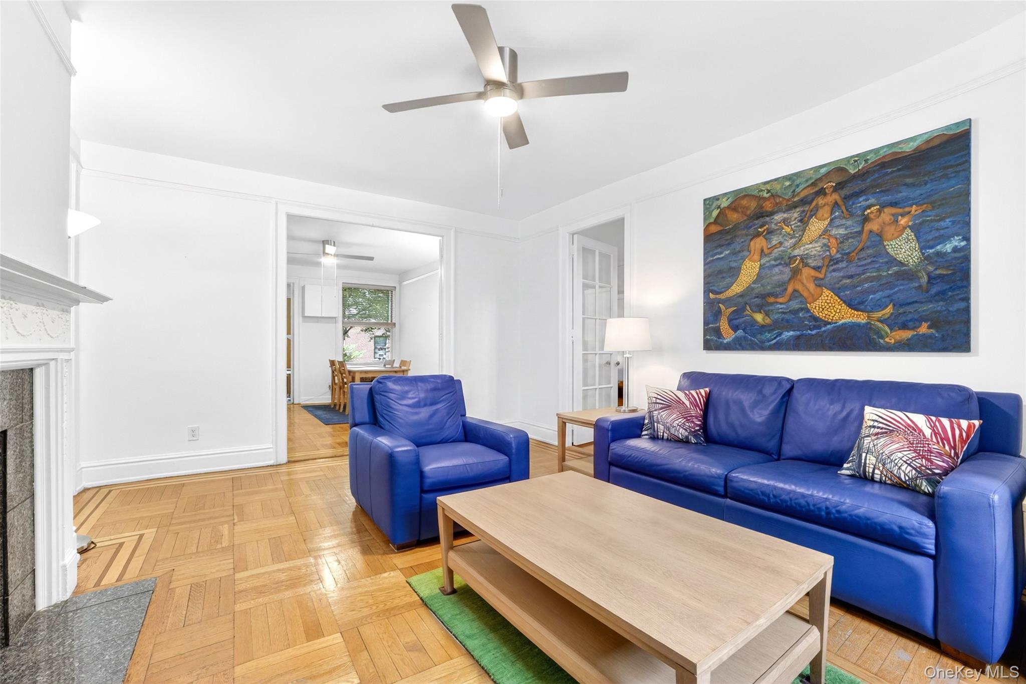 Welcome to this unique 2-bedroom, 1-bathroom cooperative apartment located in the renowned Historic District of Jackson Heights. As part of the nation’s first planned "garden apartment" community developed in the 1920s, this residence beautifully pairs rich architectural heritage with tranquil living.This spacious garden apartment features classic pre-war elegance, including high ceilings, original french doors, oak hardwood floors with mahogany inlays, and a wood burning centerpiece fireplace. A rare and notable feature of this unit is the bright sunroom, which offers a versatile space for a home office or reading nook with views of the beautiful private interior courtyard. Additionally, the building is pet-friendly and provides practical amenities such as a live in Superintendant, common laundry room, an assigned storage room, and a bike storage area.The property is perfectly situated for both convenience and lifestyle, located just steps from public transportation for an effortless commute to Manhattan or other boroughs. It is also in close proximity to the boutiques and restaurants of the 37th Avenue corridor and provides quick access to the diverse dining and shopping options along Northern Boulevard.This property is expected to move quickly! Let's schedule a viewing to experience this culturally rich historic enclave in person.
