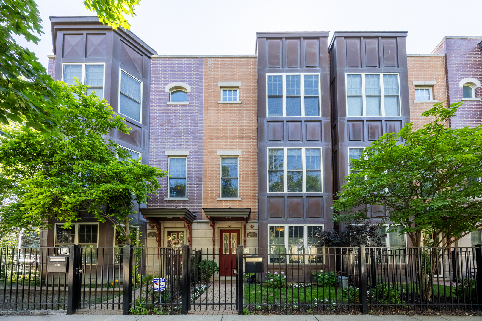 Welcome to your stylish sanctuary at 3457 North Whipple Street, Chicago-a home that's as clever as it is charming in Avondale! This 3-bedroom, 3-bathroom abode offers a perfect blend of smart design and witty elegance, ensuring every corner delights.    Step into a luminous living space where natural light dances through big, bright windows, highlighting the generous proportions and airy ambiance. Gather around the inviting gas fireplace with custom built-in cabinetry or create culinary masterpieces in the well-equipped kitchen, boasting mostly newer appliances ready to cater to your inner chef.    The primary suite is a luxurious retreat with dual vanities, a separate shower, and a soaking tub-your personal spa experience. Another large bed & full bath complete the third level. For those working remotely or hosting guests, a versatile third bedroom guestroom/office is thoughtfully placed on its own floor, providing both convenience and privacy.    Outside, the patio beckons for al fresco dining or lounging under the stars. There is also a huge private courtyard/park for unit owners behind home.  The 2-car garage ensures ample space for your vehicles, while the home's central AC and security system add comfort and peace of mind. With a newer A/C, furnace and humidifier maintaining the perfect climate, and generous storage throughout, this townhouse gem truly has it all.    Discover the perfect balance of comfort and sophistication in this well-appointed home-it's ready and waiting to welcome you!