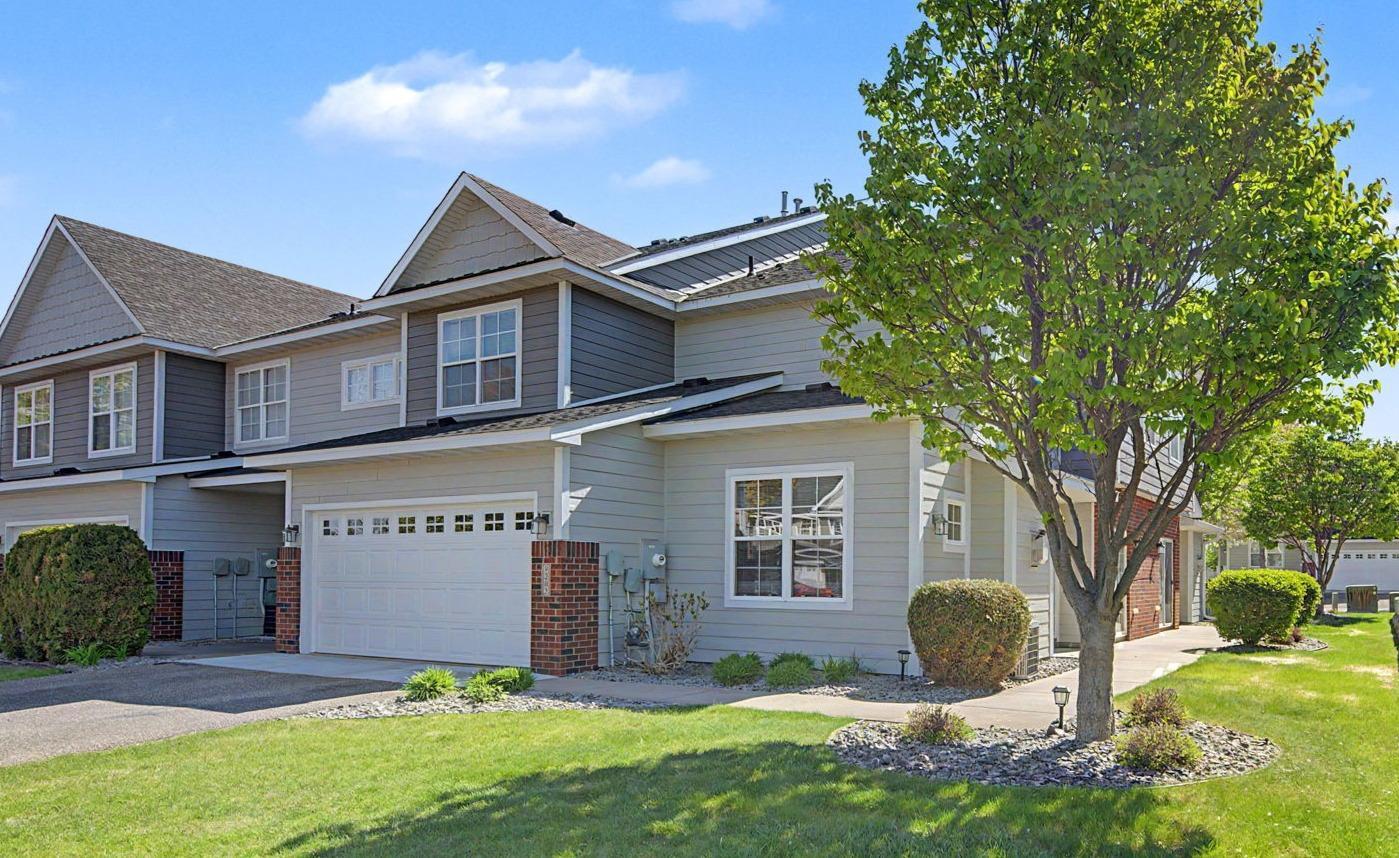 Move in ready with NEW siding, roof, garage door and interior paint. Experience the rare advantage of end-unit living in this stunning 3-bedroom townhome. Unlike most, this home welcomes you with lush lawn space right outside your front door, offering a sense of openness and a private spot to enjoy the outdoors. Inside, the pride of ownership is unmistakable, featuring a fresh coat of paint and newly cleaned carpets. The main level is a host's dream, centered around an open-concept design and a cozy gas fireplace perfect for those cooler months. Natural light floods the kitchen through ample windows, highlighting the stainless steel appliances and the inviting breakfast island. Upstairs, life gets easier with all three bedrooms and the laundry room on the same level. The primary suite serves as your personal retreat, complete with a private bathroom with dual sinks, walk-in shower and a large walk-in closet. There is also ample closet space throughout the home and extra storage space under the stairs. Perfectly positioned for both adventure and convenience, you’re steps away from hiking paths and parks, with quick access to I-94 and local dining. This move-in ready home offers effortless living, with lawn care, snow removal, and water all conveniently covered by the HOA. Schedule your tour today!