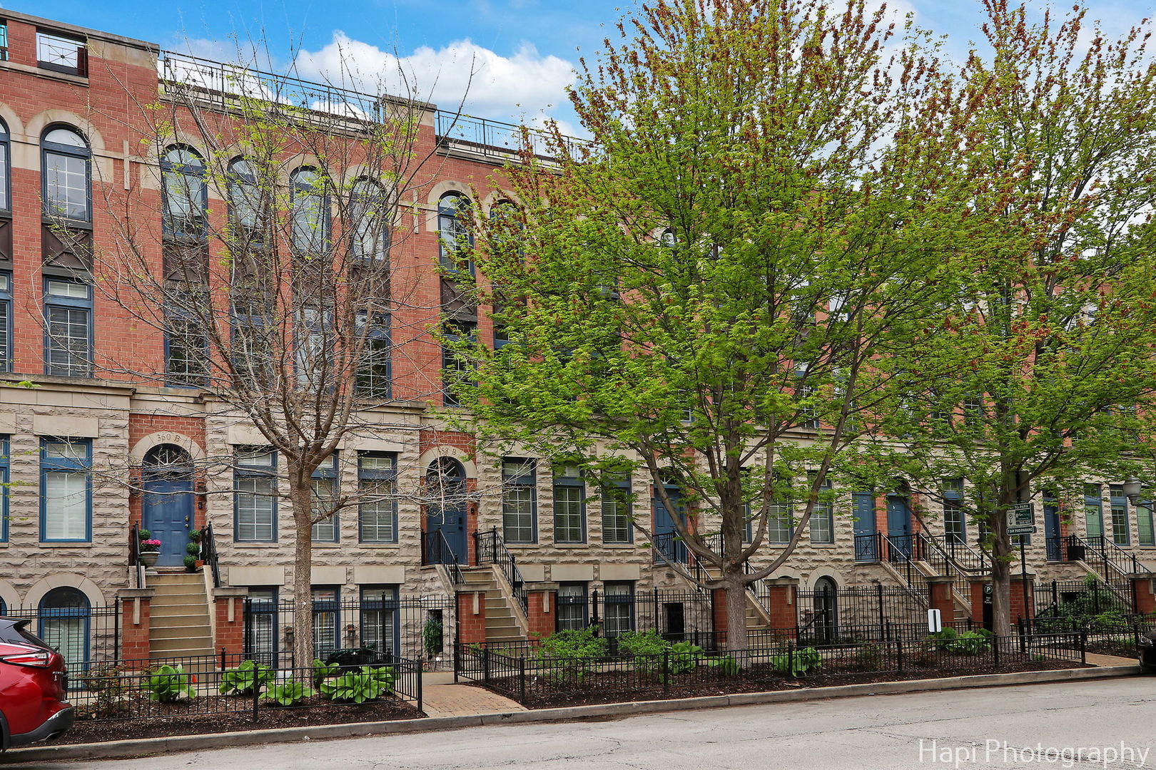 Welcome to this immaculate and meticulously maintained Tuxedo Park townhome in the heart of River North, offering the feel of a single-family home with three expansive levels of living space, soaring ceilings, and multiple private outdoor areas-including a show-stopping south facing rooftop deck with stunning skyline views! A full interior renovation was completed in 2023 by Studio W Interiors, featuring a redesigned layout that blends functionality with design-forward living. Updates include a custom kitchen and bathrooms, new flooring, detailed millwork, designer lighting, and premium finishes throughout. The home also boasts a private movie theater and seamless smart-home integrations. The open-concept main level features a light-filled living and dining room with oversized windows, a striking fireplace and a stunning chef's kitchen. Designed with both beauty and function in mind, the kitchen features all-marble countertops, custom cabinetry, high-end Monogram appliances, a built-in refrigerator and freezer, and direct access to a private balcony perfect for grilling. Upstairs, the expansive primary suite offers a warm and inviting fireplace, abundant closet storage, a dedicated workspace, and a luxurious spa-inspired bath complete with heated floors, a soaking tub, dual vanities, and a glass-enclosed shower. One additional bedroom and laundry room with side-by-side washer & dryer complete the second level. The top floor features a spacious home theater and family room complete with surround sound, a wet bar, and access to the rooftop terrace. This level also includes a generously sized third bedroom and another full bath. Marvin windows and custom window treatments throughout the home. Enjoy the convenience of an attached one-car garage, plus an additional outdoor parking space in a gated, landscaped courtyard. Situated on a quiet, tree-lined street just steps from the East Bank Club, Erie Park, Riverwalk, public transit, Whole Foods, and top-rated schools including British International, GEMS World Academy, and Frances Xavier Warde. A rare opportunity to own a truly luxurious home in one of Chicago's most vibrant and walkable neighborhoods!
