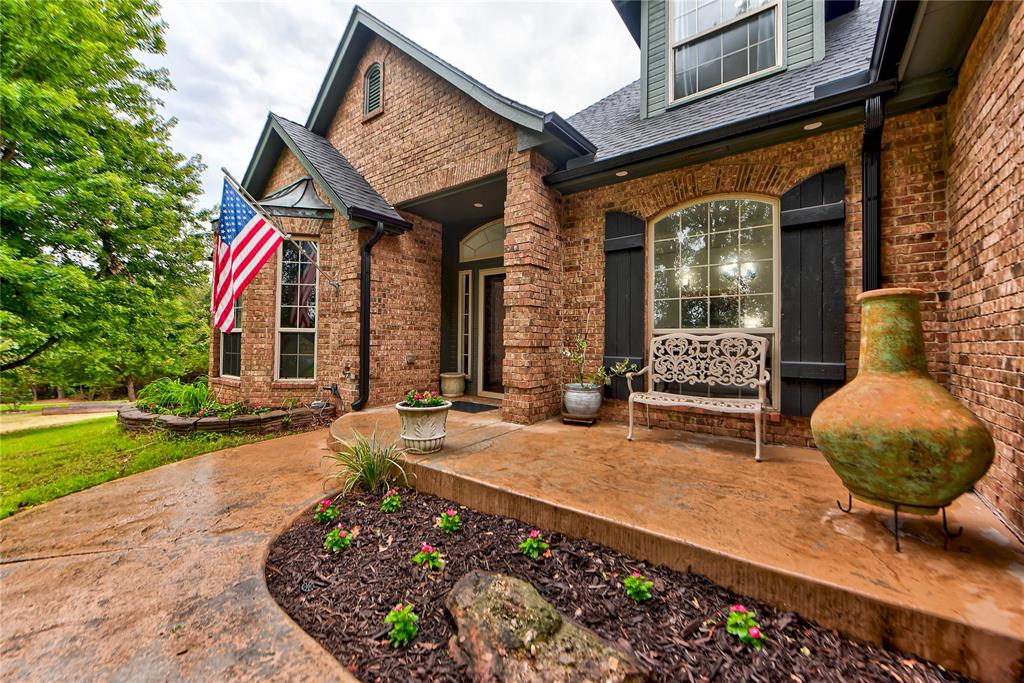 The winding drive sets the tone—an impressive home tucked among the trees on a private 1.38-acre cul-de-sac lot, with remarkably convenient access to Tinker AFB, Boeing and the city.Inside, more than 4,000 square feet gives everyone room to spread out. Three living areas, two dining spaces, a study and an office adapt as life changes and provide true flexibility. Thoughtful surprises and tucked-away storage continue throughout, making the home as functional as it is interesting. The downstairs primary suite offers privacy, space and luxury, while the second en suite is upstairs alongside two additional generous bedrooms connected by a Jack-and-Jill bath. An expansive bonus room includes an upstairs washer/dryer combination tucked into its closet, making life a little simpler.The kitchen steals the show! It is warm, dramatic and designed for people who truly love to cook and gather. Site-built cabinetry, gorgeous quartz countertops and professional-grade Viking appliances anchor the space. The custom eat-in table sits beside a wall of oversized windows that fills the room with natural light and frames the wooded backyard.This home was designed with efficiency in mind. Forty-one solar panels work alongside two new 23-SEER Lennox inverter HVAC systems, giving more than 4,000 square feet an impressive efficiency advantage. Other major improvements include a new Class 4 roof, two water heaters—including tankless service upstairs—new rear thermal windows, a whole-home water-filtration system, new interior doors, and smart outlets, switches, exterior lighting and sprinkler controls.Even the approximately 800-square-foot tandem-depth garage offers unusual flexibility for vehicles, storage, hobbies or a workshop. With 1.38 wooded acres, an incredibly versatile floor plan, extensive improvements already completed and spaces that continue to unfold as you explore, this is a home you have to experience in person to fully appreciate.