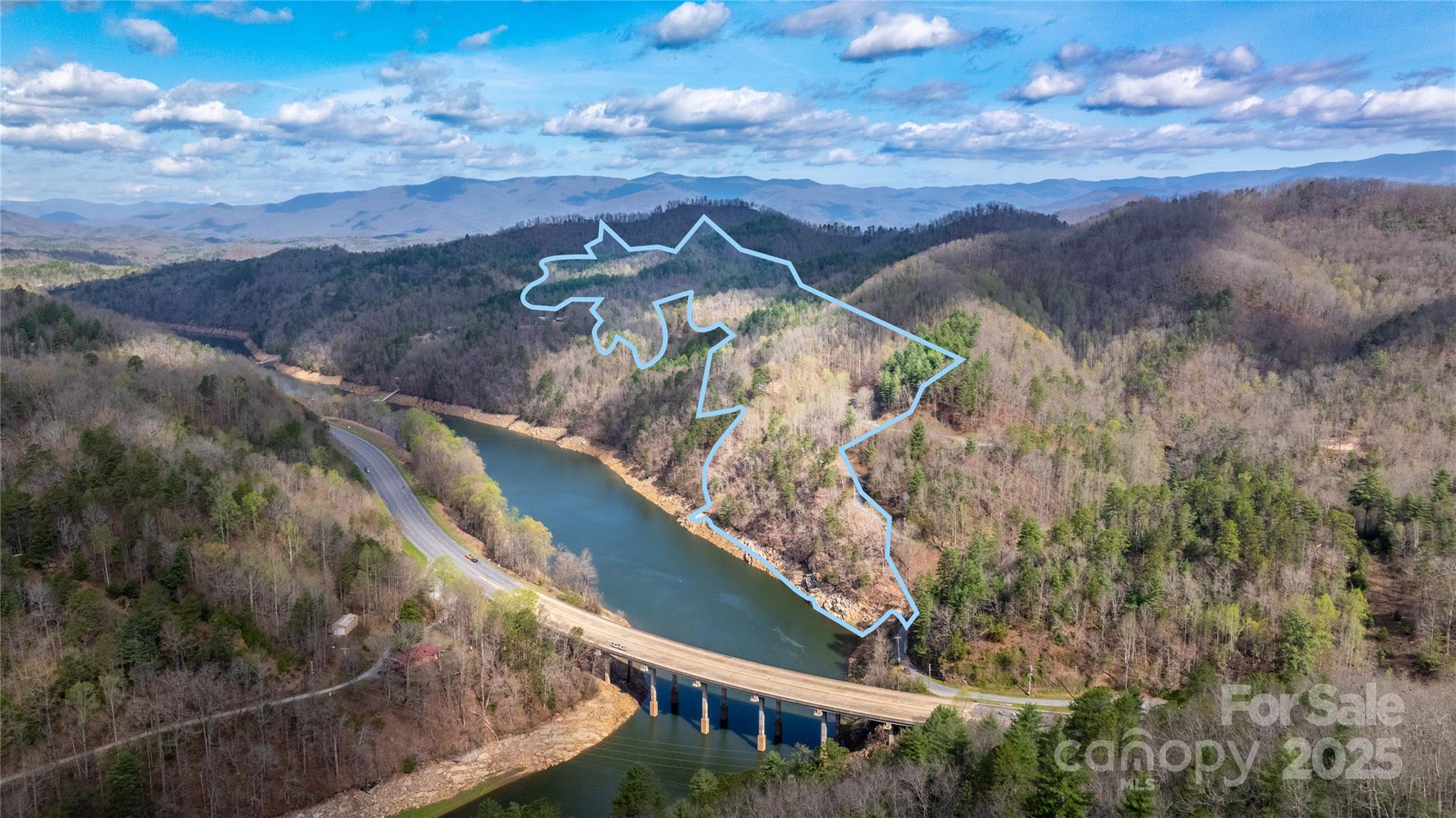 Rare Development Opportunity in Fontana Lake Estates!  Over 150 acres of prime land—featuring a 20+ acre lakefront tract with 1,700+ ft of shoreline—nestled just inside the gate of one of Western NC’s premier lakefront communities. This is the last large parcel available in FLE, offering exceptional potential for a visionary developer. An old logging road runs through the upper portion, creating a natural path for access to future ridge lots with possible long-range views. Once managed by the U.S. Forest Service, FLE is now a gated, thoughtfully planned wilderness community with a strong sense of belonging. Amenities include paved roads, a private boat ramp, day docks, a lakeside pavilion and a full social calendar in this thriving, active neighborhood. The lifestyle sells itself—and the original developers saw great success. Now it’s your turn to shape the next chapter of this unique community. Rare opportunities like this don’t come twice.