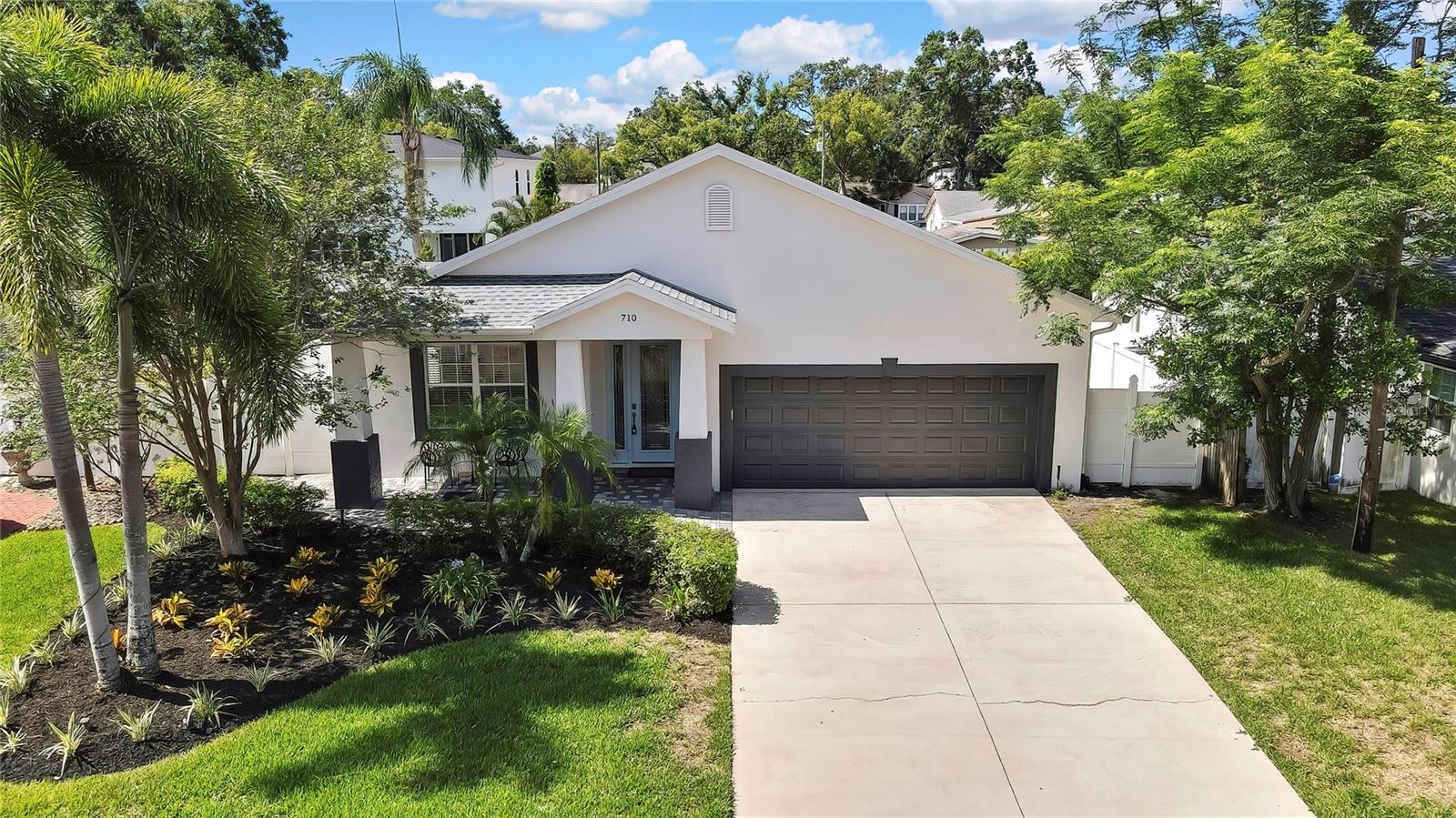 Discover this 2007 custom-built, concrete-block home on a generous 7,800 sq ft lot, featuring 3 bedrooms, 2 baths, a 2-car garage, and 2,206 sq ft of thoughtfully designed living space:
Chef’s kitchen with flair: Custom cherry wood cabinets, quartz countertops, a professionally designed crackled-glass floating bar, and a built-in under-counter wine fridge—perfect for stylish entertaining.

Master suite sanctuary: Spacious, first floor bedroom with a trey ceiling and built-in speakers extending into the spa-style bath—featuring double-sink vanity, large Jacuzzi soaking tub, and marble-like tile flooring—for a true retreat.

Oversized formal dining room: Ideal for hosting large family dinners and guests.

Prime location: Situated in Riverside Heights, this home is just minutes from Armature Works, the expanding Tampa Riverwalk, and the upcoming Gas Worx development in Ybor City. It also offers quick access to downtown Tampa, Raymond James Stadium, and Tampa International Airport.

Luxury flooring: Polished porcelain tile in the kitchen and baths; rich cherry hardwood throughout living spaces and bedrooms.

Architectural elegance: Soaring 10-ft ceilings with trey accents, crown molding, and ambient lighting enhance the living and dining areas.
Integrated audio system: Built-in speakers in the master suite, bath, and covered lanai; living room is pre-wired for surround sound, ready for a custom home theater.

Outdoor living: Relax on the large, covered lanai overlooking a fully landscaped 7,800 sq ft lot with a sprinkler system.

Move-in-ready upgrades: New roof (Dec 2023), comprehensive water filtration and softener, fresh interior/exterior paint.

Enhance your lifestyle with luxury, comfort, and modern amenities—all nestled on a spacious lot in a premier urban neighborhood.