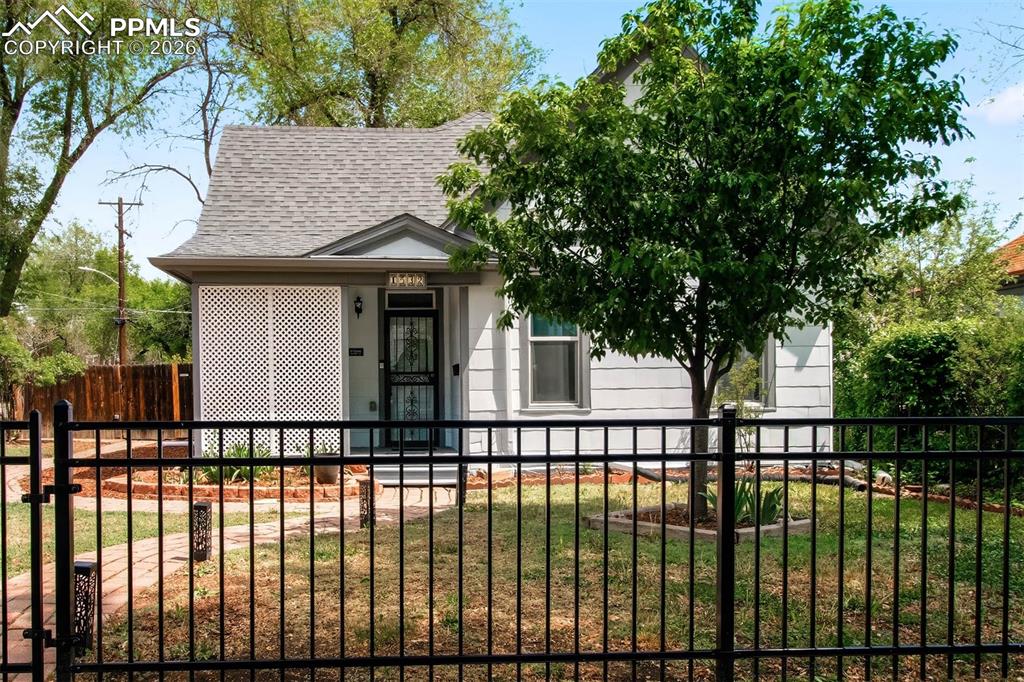 WELCOME HOME! Step into a rare blend of history, charm, and thoughtful modern living in this beautifully preserved 1889 ranch home. From the moment you arrive, you feel the kind of warmth and character that simply can’t be recreated. Imagine slow, cozy mornings on the inviting front porch, coffee in hand, taking in the peaceful surroundings. Inside, soaring vaulted ceilings elevate the space, while fresh interior paint and abundant natural light create an inviting, airy feel. The kitchen has been tastefully updated with refreshed counters and lower cabinetry, complemented by stainless steel appliances, including a gas stove—perfect for everyday living and entertaining. With 3 refreshed bedrooms and a fully remodeled bathroom, every space has been thoughtfully designed for comfort and function. The basement offers additional flexibility—ideal for storage, hobbies, or a space that adapts to your lifestyle. Behind the charm is an impressive list of upgrades that bring peace of mind: smart lights & thermostat, new carpet, updated ceilings, improved airflow w/added cold air returns, newer furnace & A/C, dehumidifier, sump pump, water heater, PEX plumbing, replaced sewer and water lines, blown attic insulation, seamless gutters, newer roof & underlayment, new fencing & a hot water recirculation pump ensuring efficiency for years to come. Outside is where this property truly shines. Situated on an oversized, meticulously maintained lot, you’ll find a private backyard retreat designed to be enjoyed in every season. A pergola-covered patio, spacious deck, solar lights, raised garden beds, greenhouse, and large shed create endless opportunities for relaxing, gardening, or gathering. Alley access leads to the detached 2-car garage for added convenience. Fresh exterior paint across all structures ties everything together, while stunning mountain views provide the perfect Colorado backdrop. This is more than a home. It’s a lifestyle rooted in character, comfort, and connection.