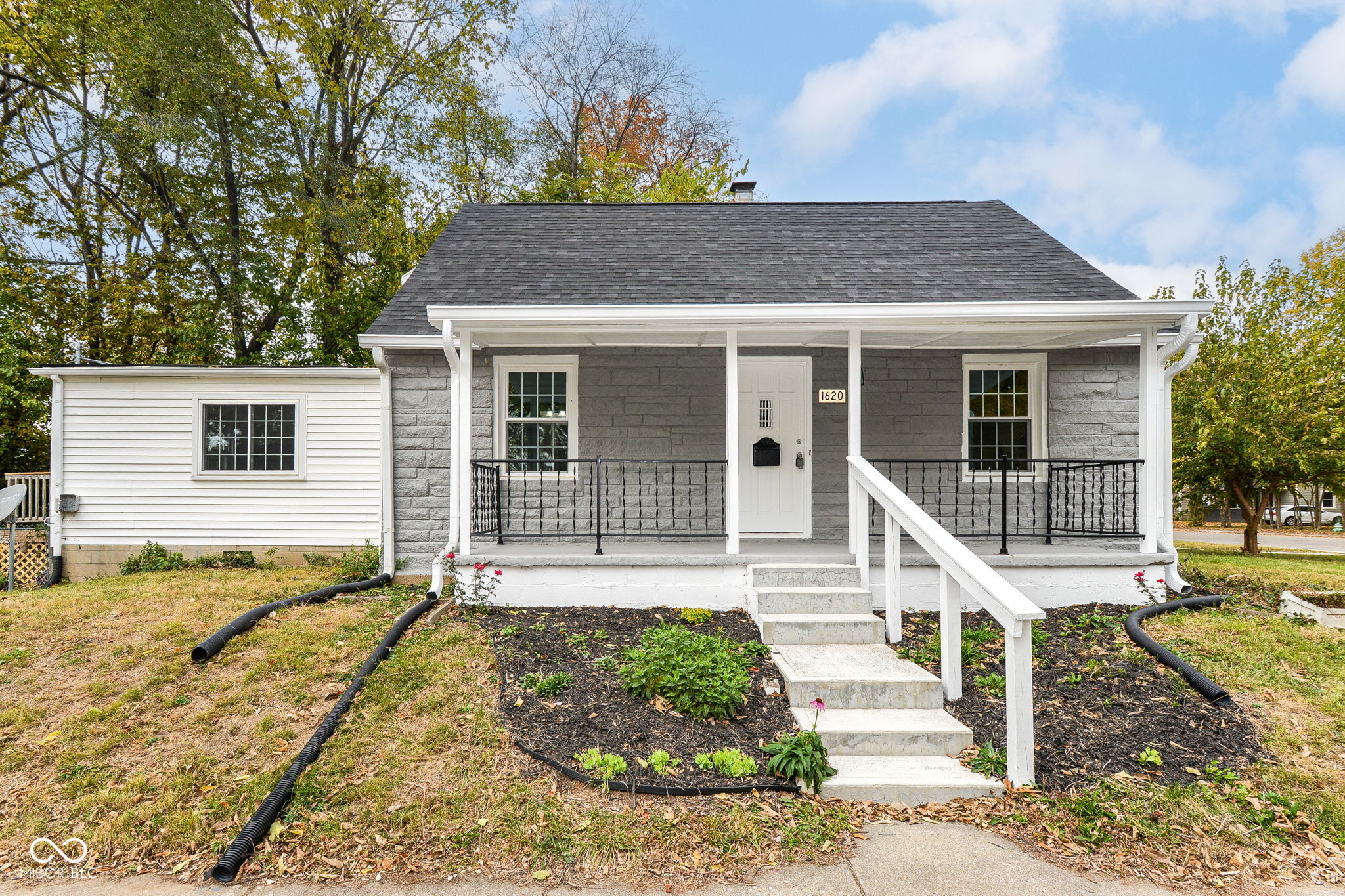 WOW! Glorious! Amazing! Completely renovated 4 bed 2 full bath, partially stone house in a quiet community. Great neighborhood location and proximity to everything one needs! Spacious floor plan. Fresh neutral paint inside and outside. Beautiful luxury vinyl flooring throughout, Stunning kitchen area with upgraded cabinets and granite countertops, and new stainless-steel appliances with built in microwave. Finished basement, New Roof, New Bathrooms, New light fixtures throughout. Beautiful freshly painted large front porch welcomes you. You can sit and enjoy the nice cool breeze. Perfect for family gathering or entertaining. Easy access to downtown, I-465, restaurants, and shopping- all for an outstanding price! MUST SEE!