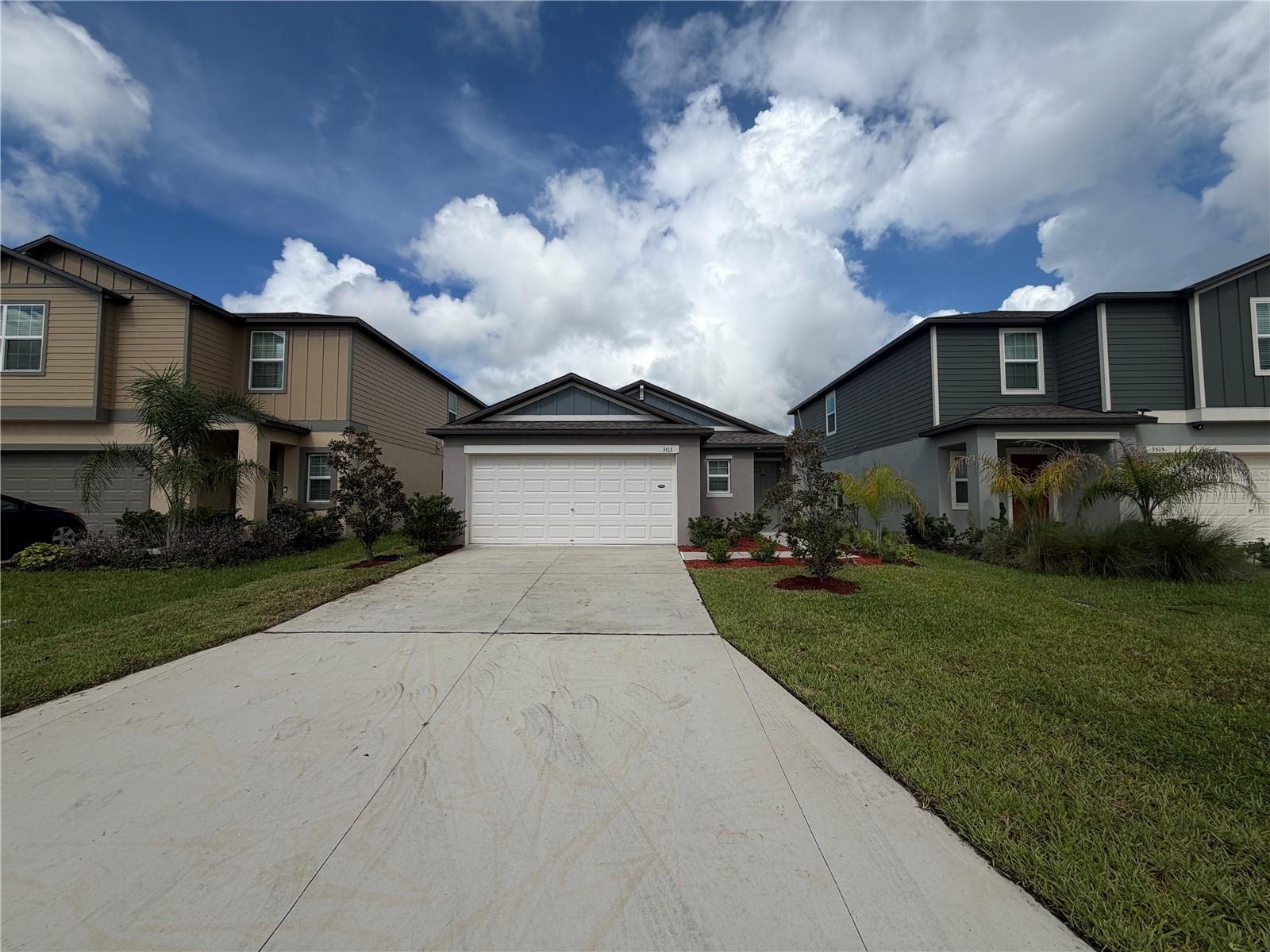 3513 Radiant Mountain Dr, Plant City FL 33565 is a home built in 2024 with 1,451 square feet. The kitchen features a center island, quartz countertops, and stainless steel appliances, creating a well-equipped space for cooking and entertaining. A dedicated laundry room adds interior utility. A covered patio extends the living space outdoors, flowing to a fully fenced backyard that creates ample room for relaxation and entertaining. An attached garage completes this well-maintained residence with practical amenities and comfortable living spaces throughout every room. Included 100-Day Home Warranty with buyer activation