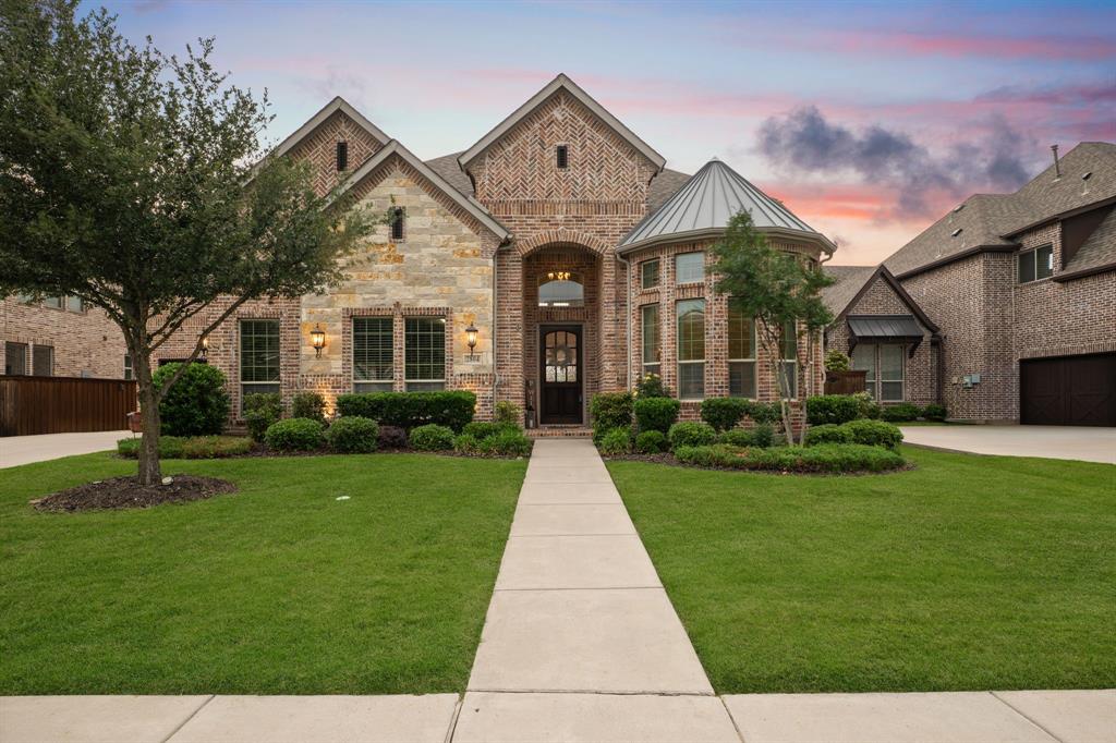 Be prepared to FALL IN LOVE with a beautifully designed 5 bedroom home offering 4,361 square feet of elegant living space in the sought after Mustang Lakes community. Thoughtfully crafted for both everyday living & entertaining, this home perfectly balances sophistication & comfort. Step inside to find soaring ceilings, designer lighting, hardwood floors & a curved staircase in the grand entry. Hardwood floors recently refinished to a stylish, contemporary light tone. Private study provides a sanctuary for working from home. An abundance of natural light fills the open-concept kitchen, dining, & family room. The gourmet kitchen is every cook's dream, featuring premium finishes, ample storage, spacious island, decorative lighting, double ovens & gas cooktop. It flows seamlessly to the breakfast room & inviting living area, making it an ideal space for hosting gatherings. Retreat to the spacious primary suite featuring a spa-like bath with separate vanities, separate shower & walk in closet. Family members & guests can rest comfortably in the generously sized secondary bedrooms, each with its own ensuite bath. For leisure & entertainment, enjoy movie nights or watch the game in the media room or spacious game room upstairs. The showstopper is the outdoor living space which is complete with a covered patio & custom pizza oven, perfect for al fresco dining under the Texas sky. The yard offers plenty of room for relaxation & play. Life in Mustang Lakes means more than just a stunning home, it’s a vibrant lifestyle. Enjoy resort-style amenities including a state-of-the-art fitness center, resort-style pools, sport courts, miles of walking trails & scenic parks. The community’s award-winning clubhouse is the hub of activity, offering year-round events that bring neighbors together. Zoned to reputable Prosper ISD & highly rated Walnut Grove High School.This stunning home offers a lifestyle that promises never-ending enjoyment & luxury.