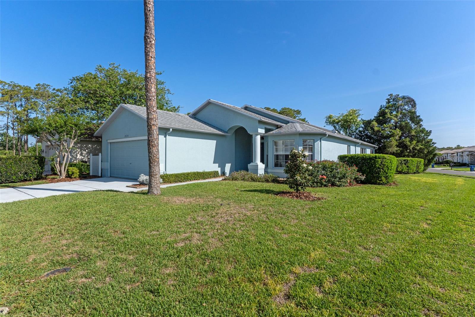 Welcome to Heritage Pines, a desirable 55+ gated community along Florida’s beautiful Nature Coast. This well-appointed 2-bedroom, 2-bath home with a dedicated office/den offers comfort, functionality, and inviting living spaces throughout. The spacious living room features a cozy fireplace, creating the perfect setting for relaxing or entertaining. The eat-in kitchen serves as the heart of the home, complete with stainless steel appliances, a breakfast bar for casual dining, and plenty of space to gather. The primary suite is a private retreat, featuring a generous walk-in closet and a spa-like ensuite bathroom with dual sinks, a soaking garden tub, and a separate walk-in shower. Step outside to your back lanai and enjoy Florida’s year-round sunshine—ideal for morning coffee or unwinding in the evening.