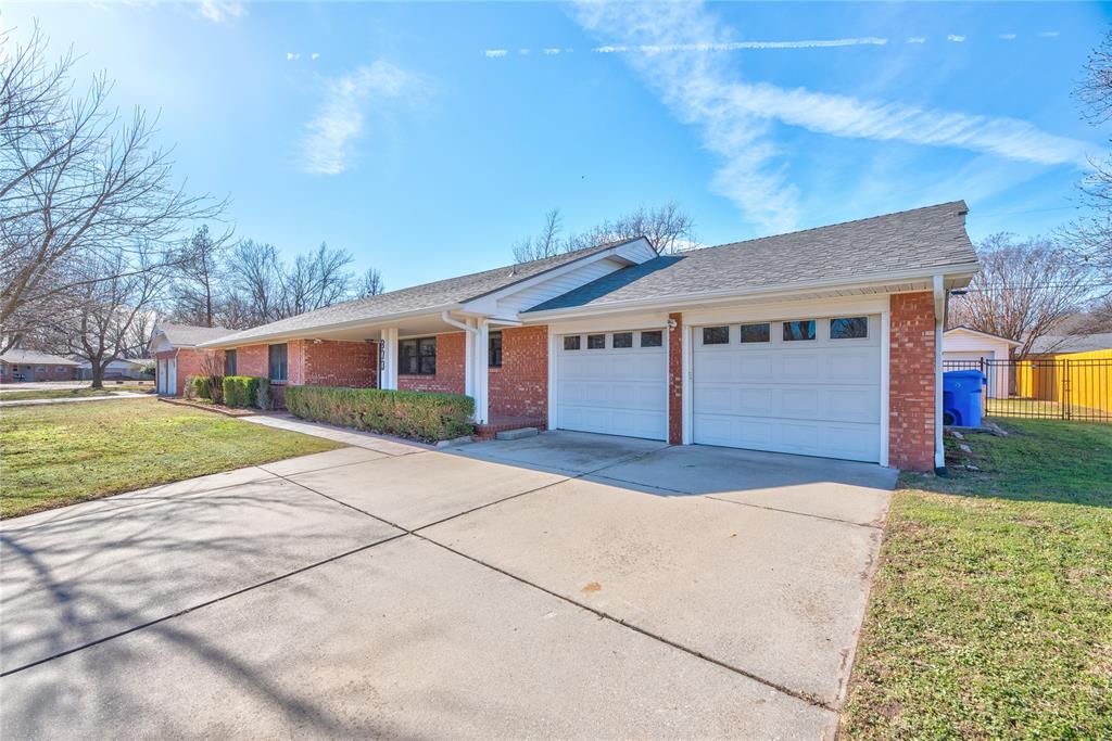 This home features 3 bathrooms and an exceptionally functional layout with generous room sizes throughout. All three bedrooms are oversized and include walk-in closets.  Storage is outstanding with three pantries plus multiple cedar-lined built-ins in the hallway, including a large walk-in closet. The main living room showcases a beautiful stone gas fireplace (could easily be converted back to wood-burning).Enjoy a huge bonus room ideal for a second living area, game room, or entertaining space—large enough for a pool or ping-pong table—highlighted by floor-to-ceiling windows and doors for abundant natural light. The laundry room includes a bath, and the additional mudroom offers space for an extra refrigerator or freezer.Outside you’ll find a recently inspected irrigation system, covered back patio, and a large two-room outbuilding with electricity—perfect for a workshop, hobby space, or extra storage. Additional updates include a new hot water tank (2025) , a roof approximately 3 years old, and a backyard storm cellar. Prime location an easy walk to campus and set among Norman’s classic tree-lined streets