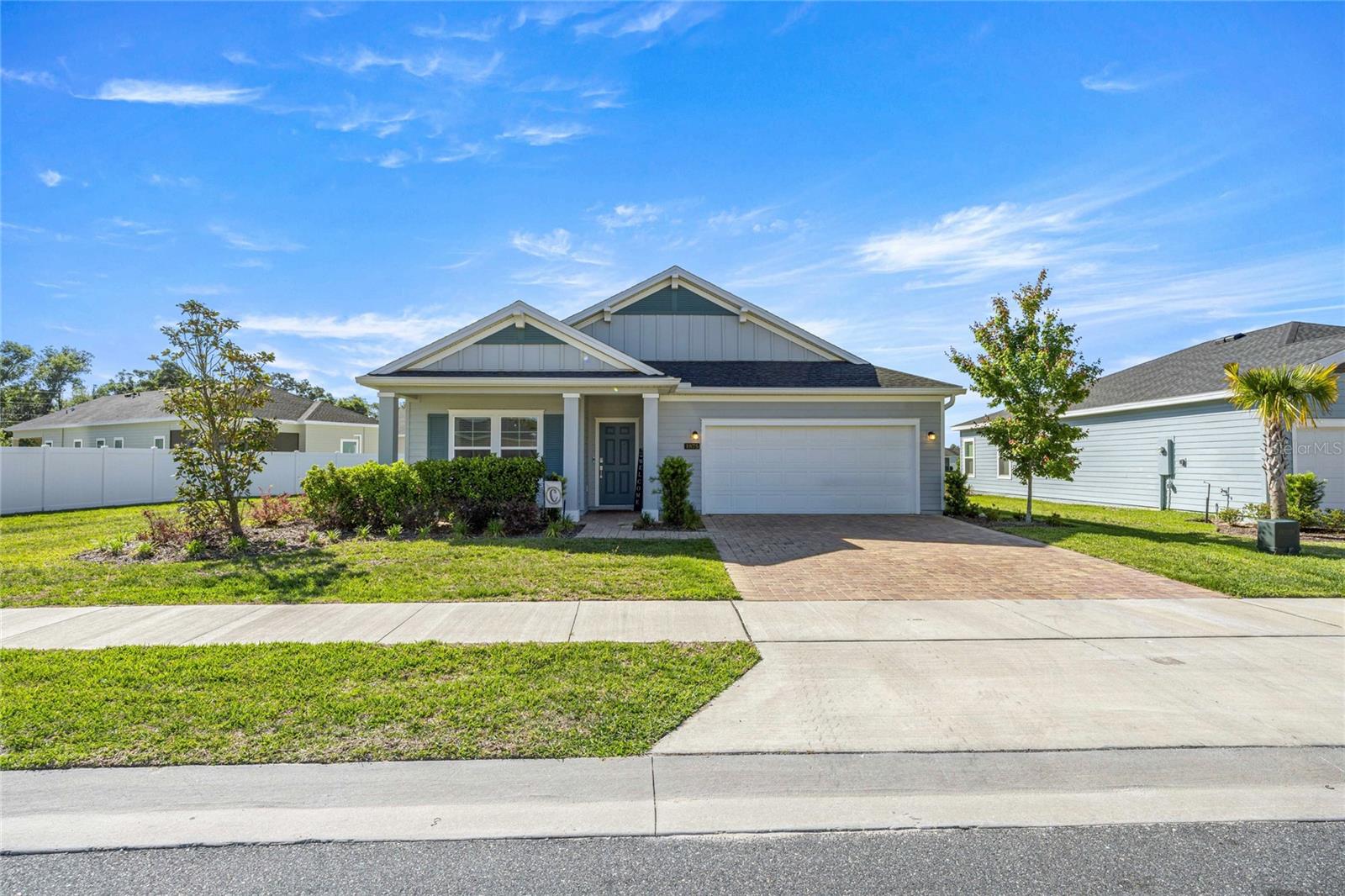 EXPERIENCE A PINNACLE OF MODERN FLORIDA LIVING in this stunning Lennar showcase model nestled within the sought-after Heath Preserve community. Designed with a seamless open-concept floor plan, the heart of the home integrates a spacious great room, a sun-drenched cafe, and a chef-inspired kitchen featuring premium stainless steel appliances, crisp quartz countertops, and a massive walk-in pantry. High-end finishes extend to the versatile flex room and separate retreat, offering endless possibilities for a home office, media lounge, or private fitness studio. Retreat to the luxurious owner’s suite, a private sanctuary boasting an oversized walk-in closet and a spa-like ensuite with dual quartz vanities and a designer-tiled shower. Step through sliding glass doors to a massive covered lanai and an expansive, fully fenced backyard secured by professional white vinyl fencing, providing ultimate privacy for outdoor entertaining or future custom enhancements. This prime location offers unparalleled convenience, situated just minutes from the World Equestrian Center (WEC), top-tier medical facilities, and boutique shopping. With easy access to I-75, renowned golf courses, and a brand-new community pool coming soon, this home perfectly balances luxury and lifestyle. Enjoy a low annual HOA in a blossoming master-planned community designed for those who demand both style and substance. Be sure to check out the 3D tours and floorplans and contact us to schedule your private viewing today!