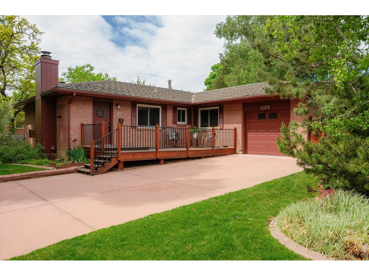 Built in value from day one! Over a 1/4 acre in Midtown. This beautifully remodeled mid-century brick home in South College Heights blends timeless character with modern updates in onFort Collins' most convenient locations. Set on more than a quarter acre, this rare 5-bedroom plus office layout offers exceptional flexibility with room to spread out, work from home, host guests, or create additional hobby and recreation spaces. Inside, two spacious main-floor living areas offer double the comfort, including one anchored by a cozy gas fireplace with built-in cabinetry. The fully updated kitchen features new cabinets, new counters, stainless steel appliances, abundant prep space, and excellent storage. Three bedrooms are located on the main level, including the primary suite with its own bath. Downstairs, the finished basement opens into a large entertainment area centered around a second gas fireplace, plus two additional bedrooms, office/flex space, and a shared full bath. Completely remodeled head to toe with refinished wood floors, new carpet, remodeled bathrooms, and new electrical panel. Outside, enjoy the huge fenced backyard with an extended concrete patio, mature trees, garden beds, flagstone pathways, raised redwood front deck, durable stone-coated steel roof, and full brick exterior. There is also an oversized one-car garage and massive driveway with ample parking. Just steps from Spring Creek Park and O'Dea Elementary and minutes from CSU and Old Town, this home offers the perfect blend of character, space, updates, and location.