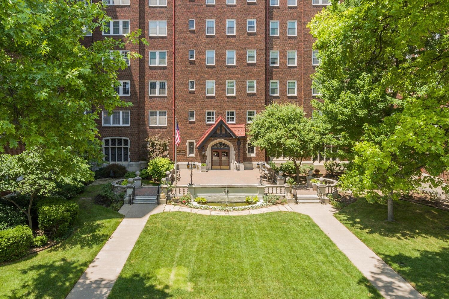 This charming co-op houses apartment beams of its vintage nature. Elegant surroundings and appointments. If you have an appreciation for historic homes, you've stumbled in to the right place. Top floor has a sunroom that views the western sky and downtown Wichita. Main floor fireplace and lovely ambiance. As an owner you own shares of the building. This unit features neutral color walls and wood floors , ready for you to create your design flair.  This apartment is shares of the Hillcrest building with a monthly HOA fee of $1,507. The dues cover exterior maintenance and insurance; 24 hour security; basic utilities and property taxes. Covered Parking, if available, is an additional $ 105 per month. Valet parking. Additionally package /grocery delivery to your door. Work out room and laundry in the shared basement accessible to co-op unit owners. Sky room available for entertaining , top floor with fabulous city views & full kitchen. No pets is building policy. There is also a guest room that owners can reserve for houseguests. Building roof was replaced in 2008, covered by HOA dues. Property being sold in present condition "as is where is without representation or warranty."
