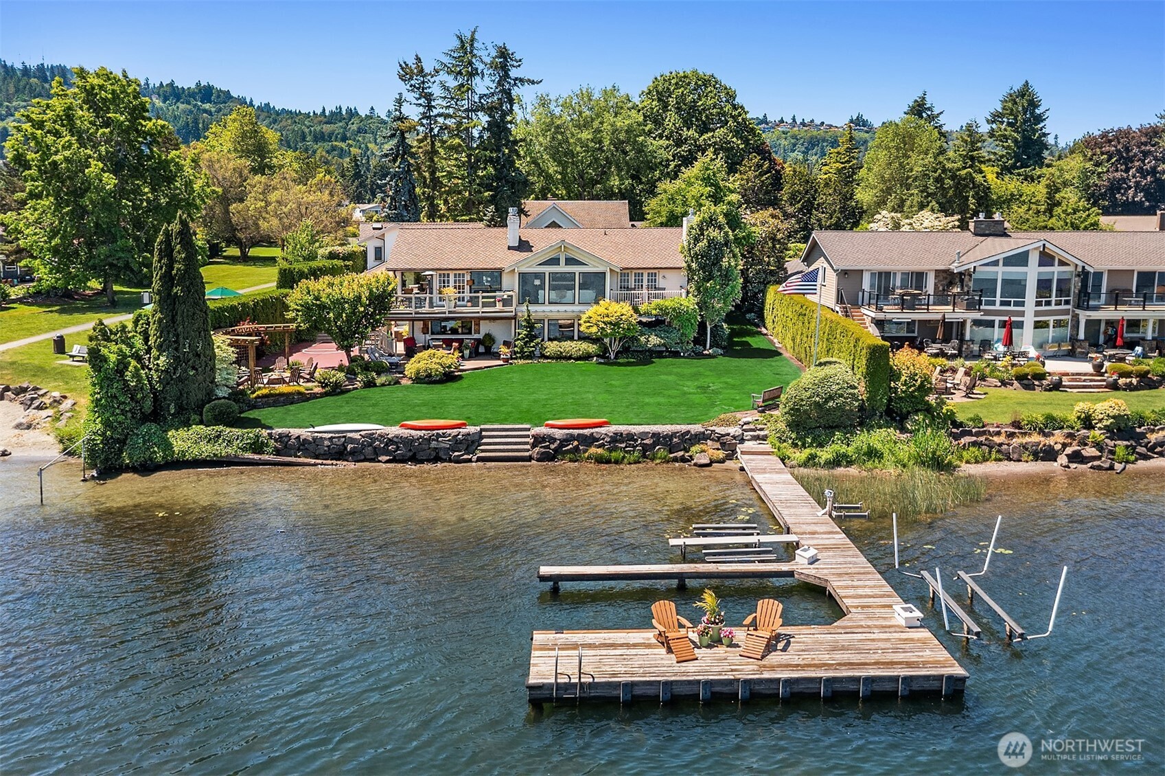 Compelling Price Improvement!  The crown jewel of South Cove on the West side of Lake Sammamish awaits. One of the most desirable neighborhoods on the lake boasting private parks, tennis/pickleball courts, playground, volleyball, private beach etc. This residence features 100’ of no bank waterfront, big dock with lifts, manicured park like grounds and lush lawn. This home is curated to perfection and is sure to delight! Enjoy the sumptuous main floor primary suite, newer MIL suite, casual & formal entertaining venues, 2 fabulous lakefront decks, one with a drop down TV set, a private sport court & nearby hot tub, ideal for unwinding after a fun day playing on the lake! At dusk, gather around the gas plumbed firepit at the shore’s edge.