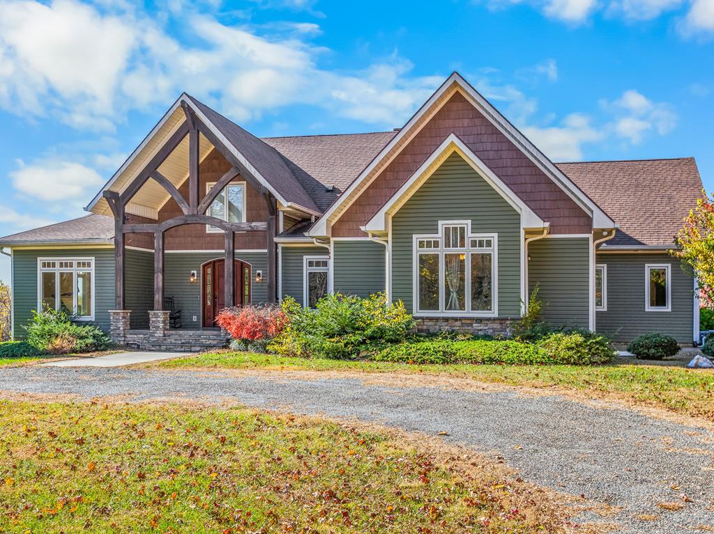Tucked at the end of a quiet, state-maintained gravel road, this custom-built 4+ bed, 4.1 bath home offers a rare blend of refined luxury & true Blue Ridge Mountain living. With 4,400+ sq ft of finished space on 16+/- acres just minutes from the Blue Ridge Parkway, this home showcases exceptional craftsmanship with arched doorways, barrel ceilings, & walls of windows framing breathtaking mountain views. The gourmet kitchen invites gatherings with granite surfaces, double wall ovens, a large island, & a walk-in pantry, flowing seamlessly into a cozy keeping room with rustic beams & a wood stove, perfect for slow mornings & fireside coffee. A butler's pantry connects to a formal dining room, creating an elegant space for entertaining. Outdoor living is second to none with 2 covered porches, a stone fireplace, outdoor sink, & mounted TV overlooking an inviting in-ground pool, ideal for summer cookouts, evening stargazing, or relaxing in complete privacy. The primary suite offers vaulted ceilings, a private patio, dual vanities, a Kohler soaking tub, & a luxurious rain shower, creating a peaceful retreat where every detail encourages rest & rejuvenation. A nearby nursery or office space & a private in-law suite expansion provide flexible options for multiple guests or multi-generational living. Upstairs, 3 additional bedrooms, 2 full baths, & walk-in attic storage offer comfort & versatility (with add'l opportunities to add more rooms, if desired). A detached 2-car garage, greenhouse, & fenced garden area with solar-powered electric fencing & 2 sheds create the perfect setup for homesteading or hobby gardening. Enjoy open pasture, wooded acreage, abundant wildlife, & even an RV hookup. Systems include zoned HVAC, a Generac generator, & a wood-burning furnace capable of heating the entire home. Experience refined mountain living where every day feels like a retreat, just minutes from premier dining, golf, & outdoor recreation at Primland Resort. Shown by appt only.
