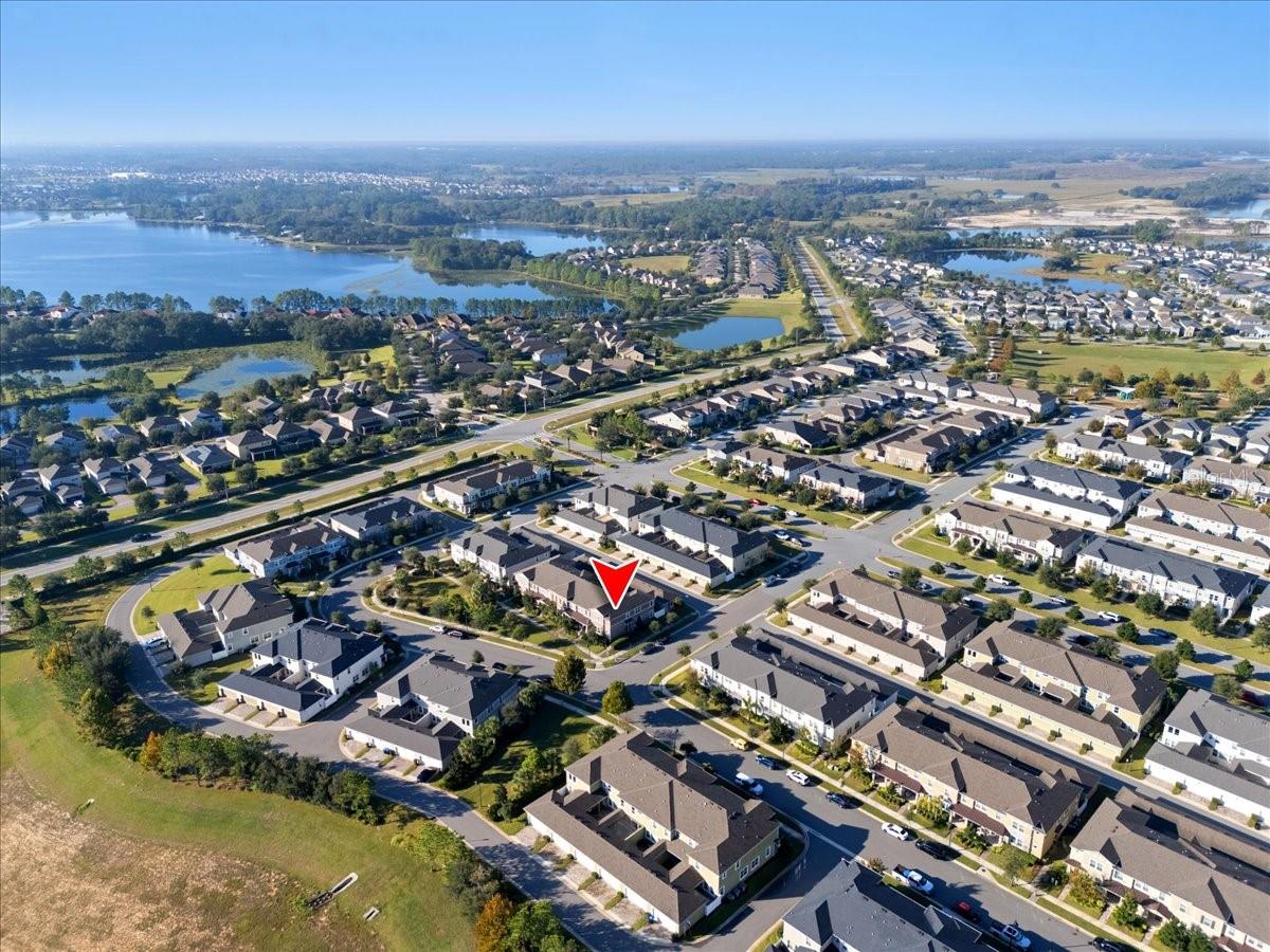 Welcome to your future home in the highly desirable Hawksmoor community in Winter Garden’s Horizon West area. This beautiful END-UNIT TOWNHOME features 3 BEDROOMS, A LOFT, and 2.5 BATHROOMS, offering a layout filled with comfort, style, and MODERN UPGRADES. As you enter, you’ll immediately notice the open and airy feel. The foyer leads into the dining area and a spacious living room with 20-FOOT CEILINGS and plenty of NATURAL LIGHT. A large PRIVATE COURTYARD provides the perfect outdoor space for entertaining or relaxing. The CHEF-INSPIRED KITCHEN includes GRANITE COUNTERTOPS, UPGRADED CABINETRY, STAINLESS STEEL APPLIANCES, BACKSPLASH, and a WALK-IN PANTRY—combining style and practicality. The first-floor features LUXURY CERAMIC FLOORING, while the second floor offers UPGRADED CARPET in the bedrooms. The FIRST-FLOOR PRIMARY SUITE adds extra convenience and privacy, featuring a LARGE WALK-IN CLOSET and a modern EN-SUITE BATHROOM. Upstairs, you’ll find two additional bedrooms—each with WALK-IN CLOSETS—a full bathroom, and a flexible LOFT perfect for an office, playroom, or extra living space. A SECOND-FLOOR LAUNDRY ROOM makes everyday life even easier. Hawksmoor offers fantastic RESORT-STYLE AMENITIES, including a sparkling pool, clubhouse with water views, walking trails, fitness center, and shaded playgrounds. The location is unbeatable, close to TOP-RATED SCHOOLS, MAJOR HIGHWAYS, SHOPPING, DINING, and world-class THEME PARKS. Beautifully maintained, this townhome offers exceptional value and an incredible lifestyle. Don’t miss the opportunity to make it yours!