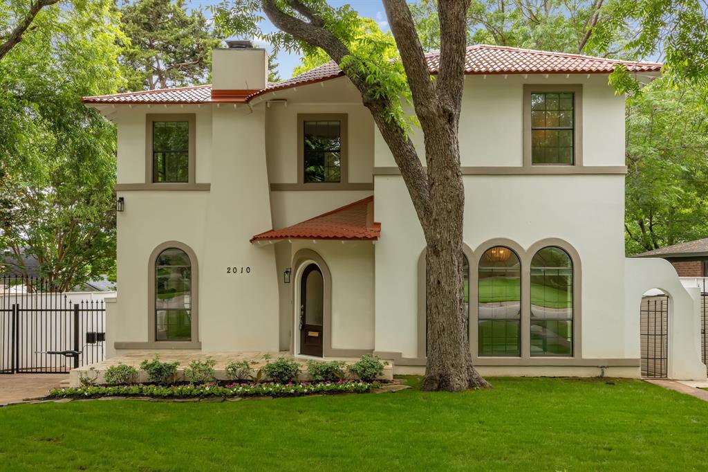 Beautifully updated 1930s Spanish Colonial in sought-after Stevens Park Estates featuring a rare 4-bed, 4-bath layout.Timeless character meets modern living with arched windows and doorways, a coved gas fireplace, and French doors that bring in incredible natural light. The oversized downstairs bedroom—lined with five arched windows—offers the perfect flex space for a private office or guest suite, with a full bath nearby. The gourmet kitchen is equipped with stainless steel appliances, a convection double oven with microwave, and a 5-burner gas cooktop, flowing into a dramatic two-story family room with soaring windows, a built-in bar, and seamless access to the backyard.Upstairs, the primary suite is a true retreat with vaulted ceilings, its own fireplace, a spa-like bath with soaking tub and oversized double walk-in shower, and a boutique-style closet. Two additional bedrooms each feature en-suite baths and generous storage.The expansive backyard offers endless potential—plenty of room to entertain, relax, or add a pool. New roof and thoughtful updates throughout. Prime location near Stevens Park Golf Course, Bishop Arts District, and Downtown Dallas, with easy access to both airports. Zoned to highly desirable Rosemont Elementary School.