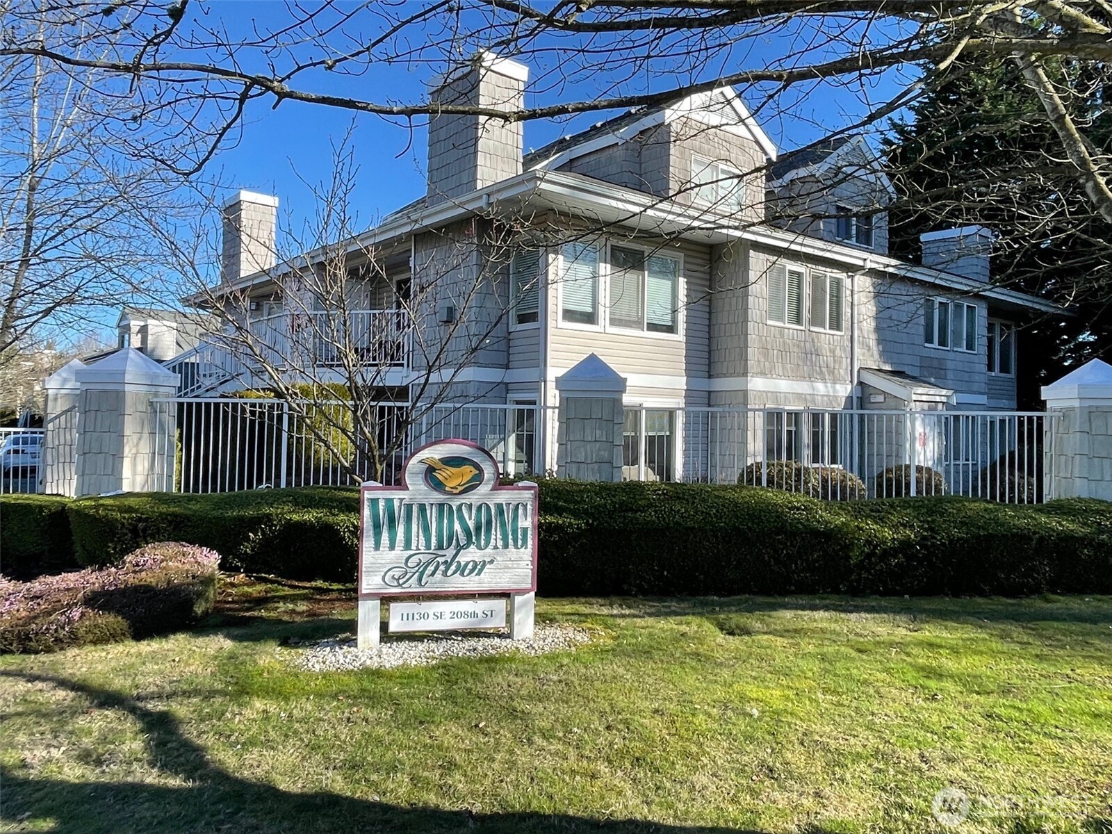 Welcome to Windsong Arbor, a gated & VA approved pet friendly community where you can relax and feel at home!  Beautifully landscaped and a short walk to busline, shopping and dining of all kinds on Benson.   Meticulously maintained lofted upper end unit offers privacy, newer paint & carpet, 2" blinds, frig and washer/ dryer.  Stay comfy with gas fireplace, inspired by cathedral ceilings, and enjoy comforts of well lit, efficient kitchen with loads of cabinets and counterspace.  Handy deck storage plus detached garage with opener and keypad entry are just steps away, and unassigned parking too.   Close to comm ctr with workout machines and room for your larger gatherings.   Owner will pay amount equal to 3 mo HOD and 2026 special assessment too!