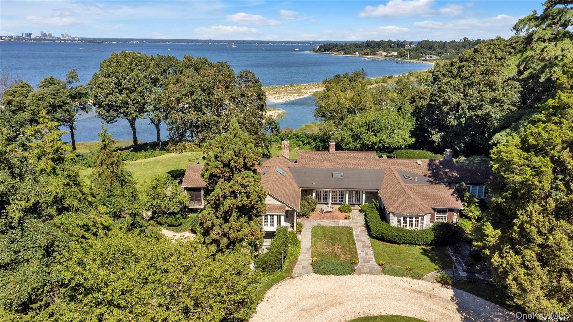 Available for the first time in nearly 50 years and one of only a handful of SP waterfront homes to offer significant acreage, 120 West Creek Farms Road allows you to experience coastal living at its best with rolling lawns, in-ground pool and expansive bluestone terraces for lounging and dining while enjoying sensational sunsets. The 4500 sf home is elevated above the flood plain and positioned to capture panoramic views from west to east. Located at the end of Sands Point's loveliest streets and surrounded by magnificently landscaped property, this home offers both privacy and easy access to the Village and to Port Washington's convenient and vibrant services and amenities.