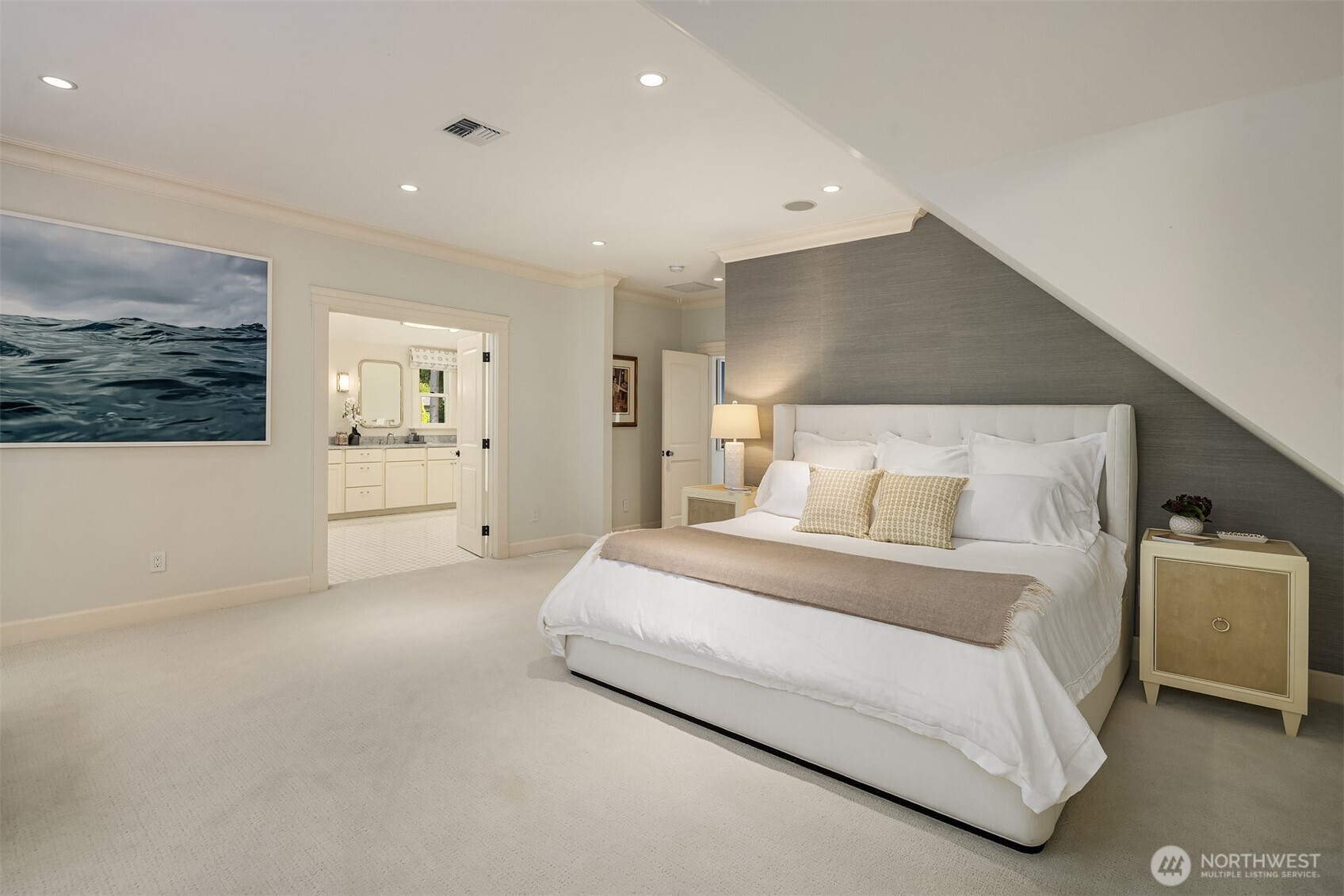Spacious primary bedroom retreat with a private en-suite bath
