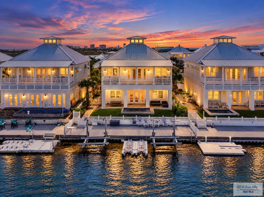 Stunning Bayfront Retreat with Breathtaking Water Views! Experience the ultimate in waterfront living with this gorgeous, fully furnished bayfront property located in an exclusive gated subdivision. Offering 2,696 square feet of beautifully appointed living space, this exceptional four-bedroom, four-bath residence combines coastal elegance, comfort & spectacular views of the bay. The spacious kitchen offers abundant room for cooking and entertaining, while the dining area provides a beautiful setting to enjoy meals overlooking the sparkling water. Take in the breathtaking scenery from the expansive covered patio or unwind on the large balcony, both offering incredible views of the bay and creating the perfect backdrop for relaxing or entertaining family and friends. Enjoy the convenience of a private boat lift for effortless access to the water. Community amenities include, Pool, basketball, volleyball, pickleball & private beach access.