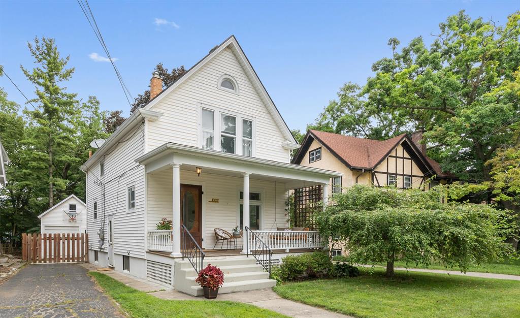 This charming Old West Side home blends vintage character with thoughtful, modern updates in a walkable, bikeable location near downtown, parks and restaurants. You will be captivated with the gracious front porch, envisioning many an evening enjoying a good book on the porch swing.  Step inside and sunlight fills the interiors, highlighting original woodwork and refinished hardwood floors. The renovated kitchen features a generous quartz center island with breakfast bar seating, tile backsplash, vintage built-ins and exposed brick. An adjacent mudroom with built-in shoe cubbies makes organization simple. The dining area off the kitchen offers beautiful views of your spacious and private yard. Experience the convenience of morning coffee or summer dinners outside on your deck. The fenced backyard, shaded by a mature maple tree, offers a welcoming outdoor space perfect for relaxing or play. Back inside, the partially finished basement expands your living space and includes built-in...storage and flex space perfect for a home office, studio, playroom, or media room. Additional key features include newer electrical wiring (no knob-and-tube), a one car garage, fresh interior paint and refinished hardwood floors (2023). The upgraded concrete driveway features integrated water drainage lines and even a convenient EV charging point. Located just steps from transit and within easy biking distance to shops, downtown, and the farmers market, this home offers a blend of original charm, smart updates, and a prime West Side location ready for its next chapter.
Home Energy Score of 3. Download report at stream.a2gov.org